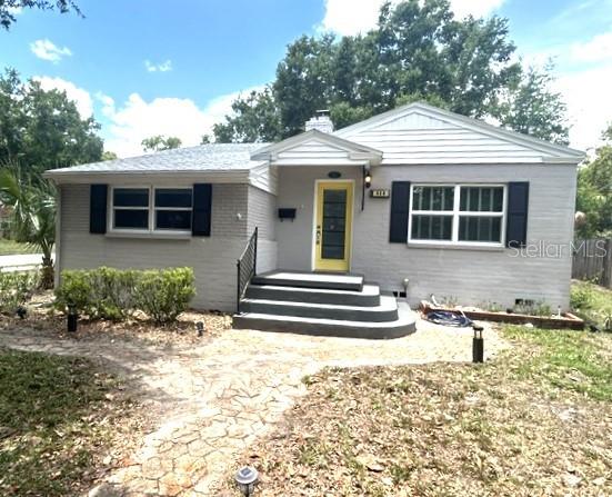 Lovely 3 BR home on large corner lot in Colonialtown South, minutes away from venues in historic Thornton Park, Lake Eola, downtown Orlando, and the Milk District.  Quiet neighborhood with easy access to multiple grocery shopping options, restaurants and night life.  Convenient access to I-4. Home features remodeled kitchen with Stainless Steel appliances, including wine refrigerator, granite countertops, and under counter lighting.  Original wood floors throughout most of the living space, with tile in kitchen, bath and bar / piano room.  Living room features charming wood burning fireplace and built-ins.  Large newer windows throughout allows an abundance of natural lighting.  Back bedroom has french doors to the charming brick paver patio.  There's a vinyl fenced back yard and convenient storage shed.    Fast electric car charging station conveys!  Newer features include Roof (2021), Brick Paver Driveway (2025), Fence and shed (2019), Plumbing (2018) and Electrical (2017).