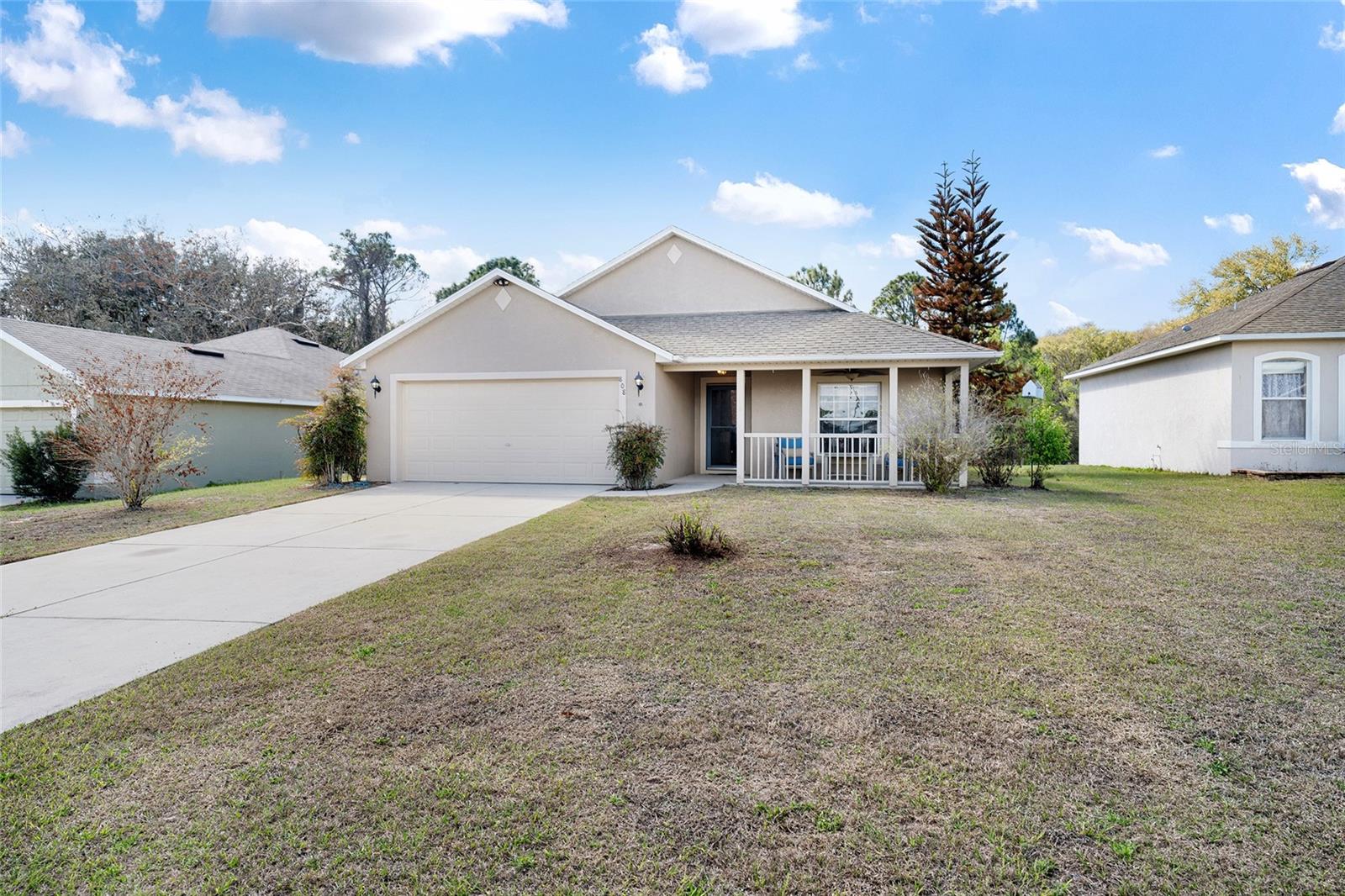 NEW ROOF INSTALLED!   3-bedroom, 2-bath home in the desirable Chelsea Run community offering comfortable, low-maintenance Florida living. With approximately 1,200 square feet, this home features tile flooring throughout and a functional, living area designed to maximize space and everyday comfort. The eat-in kitchen includes stainless steel appliances and a breakfast bar overlooking the living room? Perfect for casual meals and staying connected while entertaining. A 2-car garage adds valuable storage and convenience. Step outside to a large patio ideal for grilling or relaxing, with no rear neighbors providing added privacy and a peaceful backyard setting. Conveniently located in Fruitland Park with easy access to shopping, dining, and The Villages. A solid opportunity to own in a well-established neighborhood with room to make it your own.