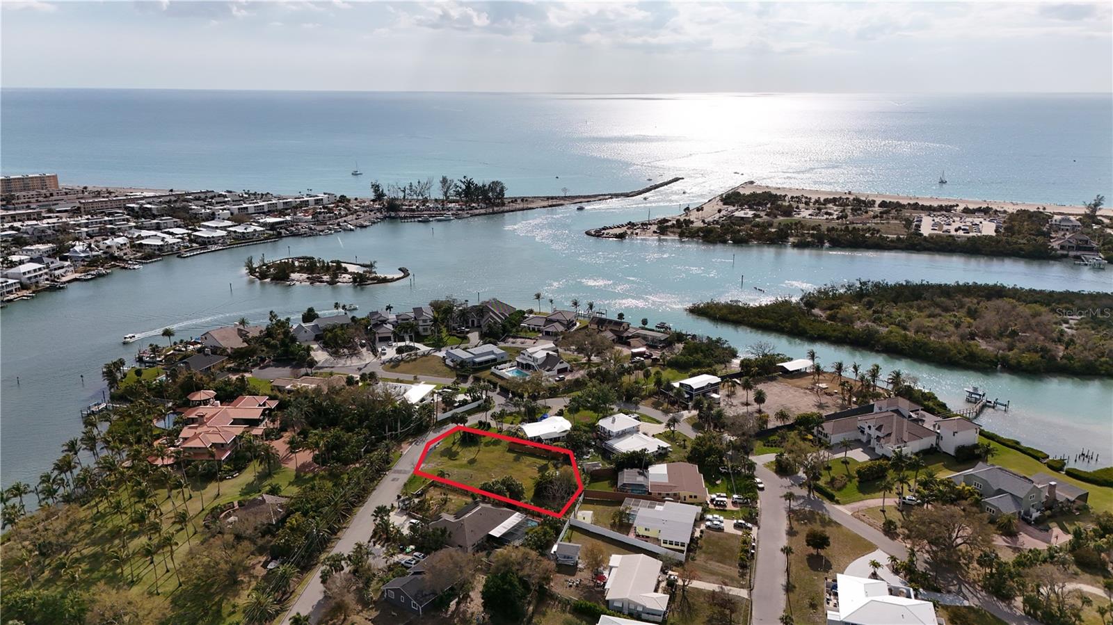 Cleared buildable parcel primed for your dream home, this 0.32-acre lot is your canvas to create a coastal haven in one of Sarasota County’s most coveted neighborhoods. Nestled in the historic Bay Point subdivision, this property is perfectly positioned across from some of Dona Bay’s most impressive waterfront estates. Just steps away, discover Lyons Bay Park, a local treasure lovingly called "The Honeyhole." This hidden gem offers a serene escape for kayaking, paddleboarding, fishing, waterfront picnics, or simply basking in golden sunsets with your toes in the sand. With its pedestrian-friendly vibe (no parking keeps it wonderfully tranquil), it’s a spot you’ll want to return to again and again. This expansive 13,741 sq/ft lot gives you endless possibilities to design your ideal home. With no HOA, and no CDD fees, you have the freedom to build your vision, including the potential for stunning water views in nearly every direction. County water, internet, and electric are already at your fingertips, offering modern convenience in a charming "West of the Trail" coastal setting.
This location is simply unbeatable. You’re just one mile from two public boat ramps, a quick bike ride to the white sands of Casey Key and Nokomis Beaches, and ideally situated between Sarasota’s vibrant cultural scene and Venice Island’s historic charm. Spend your days exploring boutique shops, indulging in lively festivals and farmers markets, or catching a show at Venice’s world-class theater. And when you are ready to unwind, you’ll have four gorgeous Gulf Coast beaches practically in your backyard.
This is your chance to craft your very own slice of paradise in a location where opportunities like this are rare. Survey available from the current owner—don’t let this dream slip away!