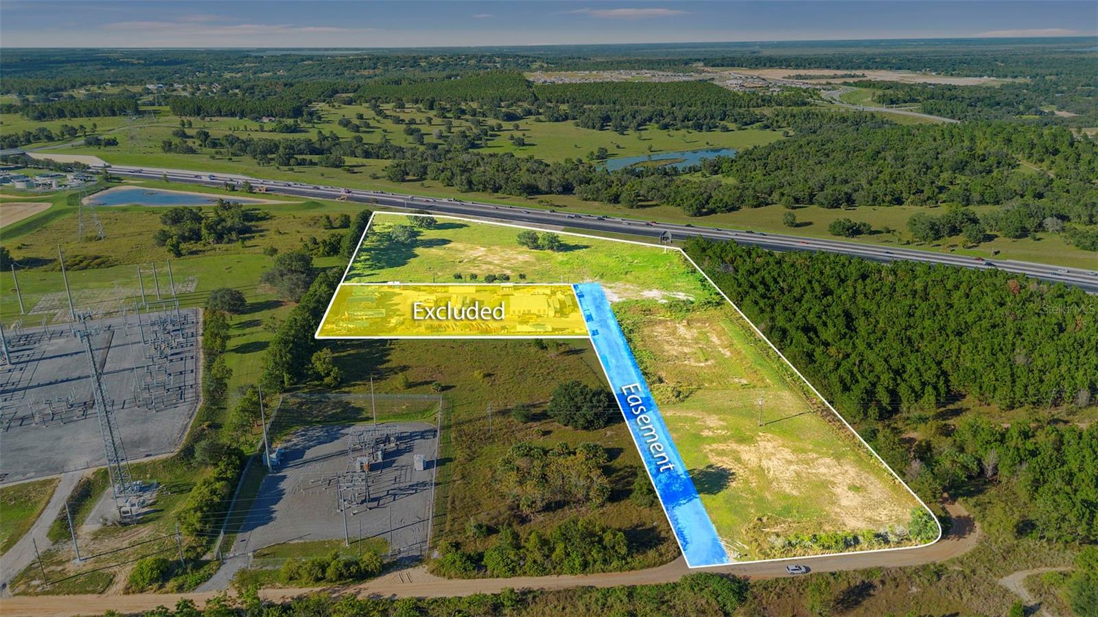 Exceptional opportunity to acquire 10.5± acres of partiatly entitled true industrial-zoned development land located directly along the Florida Turnpike in the City of Minneola, Lake County. The property is part of a larger 13-acre tract, with 2.23± acres to be sold to an existing tenant who will retain a shared driveway easement for access. The remaining 10.5± acres provide excellent visibility and immediate adjacency to the $1B+ Hills City Center mixed-use project.
Surrounding Development Includes:
Hills City Center — 1.4M SF of industrial, 600K SF retail, 500K SF medical, 1,000+ multifamily units
AdventHealth Minneola Hospital Campus — $281M+ medical development now underway
New Horizon Academy K–8, new residential communities, and over 13,000 approved housing units within 5 miles.
Property Details
Size: 10.5± acres (after subdivision)
Zoning: Industrial (City of Minneola)
Access: Shared driveway easement to tenant parcel
Utilities: City services available nearby
Frontage: Backs to Florida Turnpike with potential signage visibility
Location: Within minutes of SR 50 and US 27, with immediate Turnpike access
Highlights: Adjacent to major mixed-use and industrial expansion. Part of the high-growth Hancock Road / Turnpike corridor. Ideal for distribution, flex, or build-to-suit industrial users. Strategically positioned for Orlando MSA logistics and manufacturing connectivity. This property offers a rare chance to secure industrial land in a market poised for exponential growth, surrounded by large-scale medical, commercial, and residential investment.