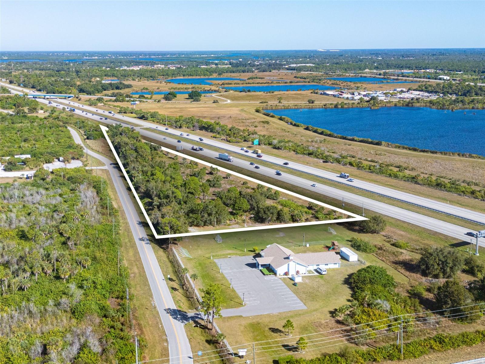 Welcome to One of the most visible commercial opportunities in Punta Gorda. 7300 Florida Street offers an approximately 4.72-acres, CG-zoned commercial general site with direct exposure to Interstate 75, capturing tens of thousands of vehicles every day and delivering true, irreplaceable highway presence. General Commercial zoning provides exceptional flexibility for a wide range of uses, including retail, medical or professional offices, restaurants, auto-oriented and service businesses, or a high-impact commercial development designed to dominate the corridor. The site may also lend itself to cell tower or communications infrastructure, creating additional income or value-add potential. Depending on layout, access, and stormwater considerations, the property could support small-footprint, drive-to concepts such as a coffee
kiosk, quick-service or express-service uses. An owner-user yard or contractor yard may also be possible, subject to verification of CG zoning conditions and permitted uses. With easy interstate access, outstanding visibility, and a growing trade area driven by Charlotte County’s expansion, this is a location where brands are noticed, tenants thrive, and long-term strategies perform. If you’re looking to place your business, your tenants, or your investment front and center along one of Southwest Florida’s most traveled corridors, this site delivers exposure that cannot be replicated. High traffic. High visibility. High potential7300 Florida Street is where commercial strategy meets highway presence.