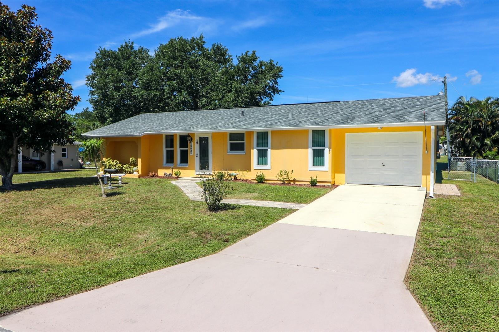 POTENTIAL 3RD BEDROOM | MAJOR UPDATES COMPLETE | NO HOA | INVESTOR-FRIENDLY | FULLY FENCED | 220 RV PLUG |Welcome to this well-maintained 2-bedroom, 2-bath, 1-car garage single-family home offering 1284 sq ft under air (1,572 total sq ft) in the heart of Port Charlotte—just minutes from everything you need and only ~3 miles to Charlotte Beach Park. This property delivers true peace of mind with BIG-TICKET UPDATES ALREADY DONE: ROOF-2023, A/C-2019, IMPACT WINDOWS/FRONT WINDOWS-2025, UPDATED ELECTRICAL PANEL-2026, and PUBLIC SEWER CONNECTION-2018. Built with solid block construction, this home has stood the test of time since 1978—proven durability in Florida’s climate. Step out back to the 11 x 25 brick patio area, ideal for grilling and enjoy a fully fenced yard perfect for pets and the kiddos to run and play.  There is also a large 10 x 12 storage shed that has electric, and a 220 RV outlet.  ADDITIONAL HIGHLIGHTS:  Sitting bench in Master bath shower, Hurricane Panels in shed, Master closet measures 5' x 12',  all wood kitchen cabinets, laundry tub in utility room. Located on public water and public sewer with NO HOA and NO DEED RESTRICTIONS, this property is perfect for homeowners and investors alike. No rental restrictions allow for flexible income potential—seasonal or annual. Positioned in a desirable area with great schools, established neighborhood feel, and close proximity to shopping, dining, medical facilities, and waterfront parks, this home checks all the boxes for Florida living. Whether you're looking for a primary residence, seasonal getaway, or income-producing property—this one is ready to go.