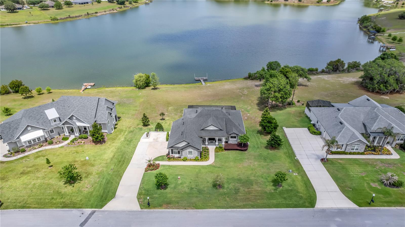 A $1 Million view for under $1 Million! Rare is the opportunity to own a custom-built masterpiece that offers direct waterfront living at an incredible value. Nestled on a sprawling 1-acre lot within the luxurious community of Black Bear Reserve, this estate features a backyard that opens directly onto the serene waters of Black Bear Lake, complete with your own private dock.

Inside, this custom home is a study in elegance. The gourmet Chef’s Kitchen is a culinary dream, designed with high-end finishes and an open flow perfect for hosting. The entertainment continues outdoors in your massive private sanctuary, featuring a custom pool with a built-in hot tub and a professional-grade outdoor chef's kitchen. While the home offers peaceful seclusion from the golf course, you are just a two-block golf cart ride away from the clubhouse.

Unbeatable Lifestyle & Convenience:

Golf & Dining: Enjoy the perks of the Black Bear Golf Club, a public-access course with no mandatory membership fees. The clubhouse restaurant is your go-to spot for social dinners just minutes from your front door.

Waterfront Living: Fish, paddleboard, or enjoy sunset views right from your private dock.

Daily Ease: You are only 5 minutes from Publix and local shopping, making errands a breeze.

Perfectly Positioned: Experience the historic charm of Downtown Mount Dora and Eustis in just 15 minutes, or reach the heart of Orlando in 45 minutes.

With over an acre of land, a private dock, and a custom pool deck that rivals a five-star resort, this is the waterfront lifestyle you've been waiting for. Schedule your private tour today!