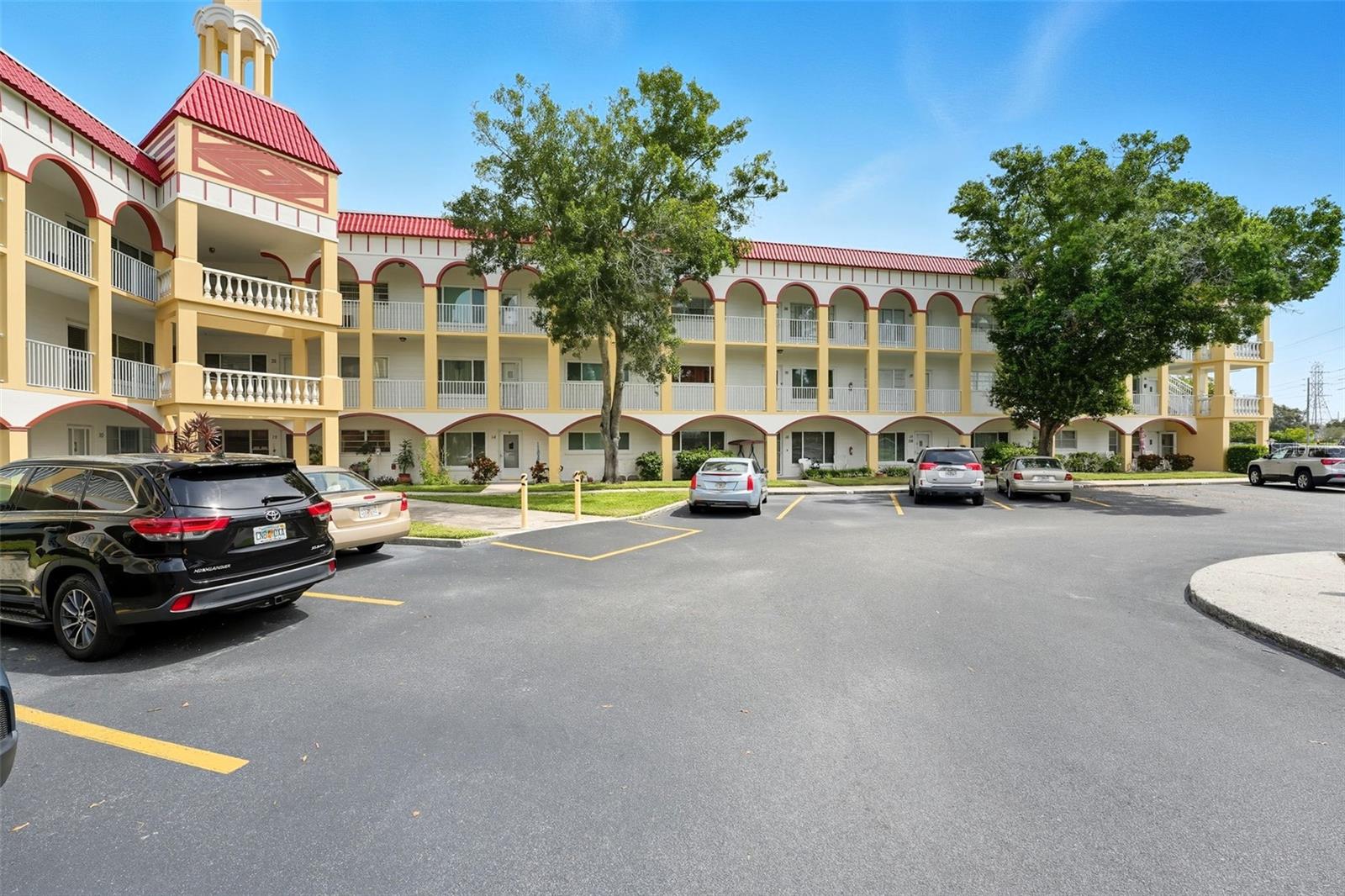 Looking for one of the BEST VALUES in On Top of the World? This BEAUTIFULLY UPDATED 2-BEDROOM, 2-BATH condo offers approximately 1,400 square feet in one of Clearwater's premier 55+ communities. Perfectly positioned DIRECTLY ACROSS FROM THE GOLF COURSE, this third-floor residence enjoys ONE OF THE MOST PRIVATE AND SERENE REAR VIEWS IN ON TOP OF THE WORLD, overlooking a semi-wooded setting with mature trees that provide exceptional privacy and a peaceful backdrop. PET FRIENDLY with NO WEIGHT OR NUMBER RESTRICTIONS for dogs, a rare feature among 55+ communities.

Inside you'll find UPDATED TRAVERTINE AND PREMIUM STRAND-WOVEN BAMBOO FLOORING, an UPDATED KITCHEN featuring QUARTZ COUNTERTOPS, modern appliances, and a thoughtfully designed pantry cabinet that keeps the microwave at convenient counter height while preserving valuable countertop space. UPDATED BATHROOMS include a renovated guest bath with a comfort-height commode, and the home also offers the convenience of an IN-UNIT WASHER & DRYER.

The $535 monthly condo fee includes WATER, SEWER, TRASH, HIGH-SPEED FIBER OPTIC INTERNET, 120 BASIC CABLE CHANNELS, BUILDING INSURANCE, exterior maintenance, and maintenance of the community's outstanding amenities, including UNLIMITED GOLF on both the 9-hole and 18-hole golf courses at no additional cost. Residents enjoy two heated pools, tennis, pickleball, a remodeled fitness center and cardio gym, hobby studios, a woodshop, library, dog park, fishing, kayaking, daily shuttle service, Good Karma Café, and an active calendar of clubs, classes, and entertainment.

Conveniently located just minutes from Clearwater Beach, downtown Dunedin, shopping, dining, and medical facilities, this exceptional home offers the perfect opportunity to enjoy Florida's active adult lifestyle in one of Clearwater's most desirable 55+ communities.
