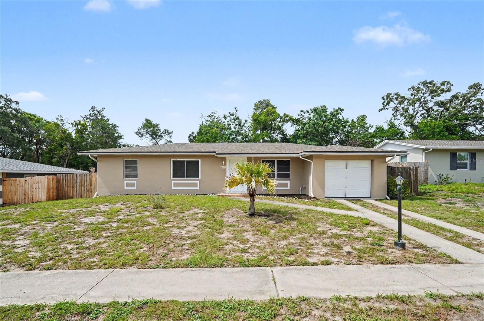 Welcome to this beautiful 3-bedroom, 2-bathroom pool home in the Spring Hill neighborhood. This property features a welcoming open floor plan that creates a seamless flow throughout the main living areas. The kitchen is thoughtfully appointed with striking solid surface countertops and sleek appliances, making it a highly functional space for cooking and gathering. Step outside to discover your own personal retreat, complete with a private pool and a fully fenced-in backyard that is perfect for outdoor entertaining or relaxation. Ideally situated, this home is conveniently located near shopping, dining, parks, schools, and major roadways, providing easy access to all your everyday essentials. Schedule your private showing today!