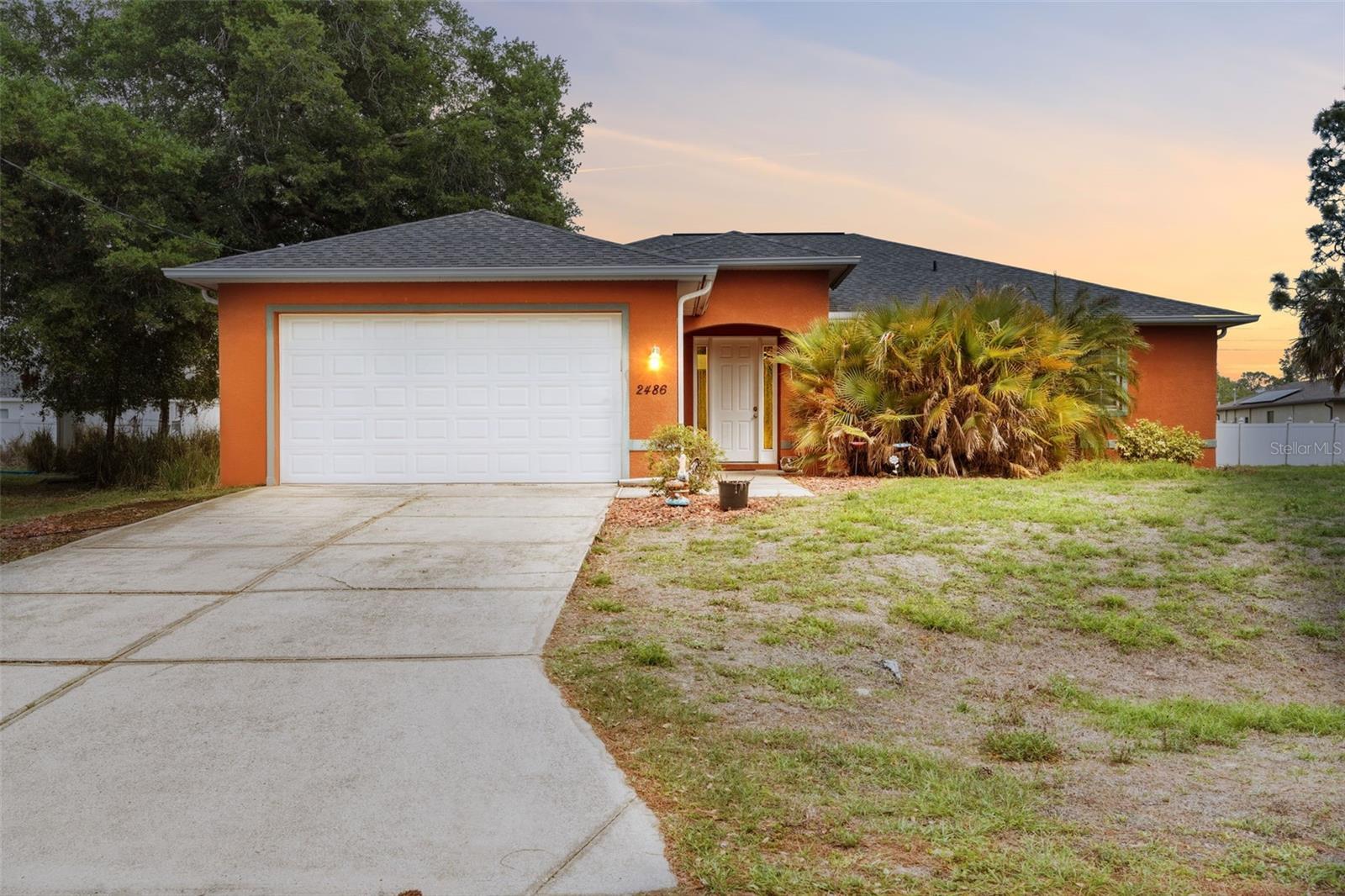 RARE FIND! This beautifully maintained 3-bedroom, 2-bath home built in 2008 offers over 2,000 sq ft of living space and sits on an expansive triple lot totaling 0.71 acres — a true standout in North Port. NO HOA | NOT IN A FLOOD ZONE.

Designed for both comfort and entertaining, this property delivers the ultimate Florida lifestyle with exceptional outdoor living and privacy. The fully fenced yard features lush landscaping, a custom fire pit area set beneath a canopy of palms, two storage sheds, and a spacious paver patio. The screened-in pool area is a showstopper, complete with a heated saltwater pool featuring therapy jets and customizable LED lighting, plus a custom granite bar with rope lighting — perfect for hosting or relaxing poolside while enjoying your favorite game or movie.

Inside, the home is equally impressive with 9.5’ volume ceilings, 8’ doors, and tray ceilings in the living room, dining area, and primary suite, creating a bright and open feel throughout. The kitchen is equipped with Gold Series appliances, while both bathrooms have been tastefully updated with granite countertops and tiled showers. The primary suite is currently being enhanced with a freestanding soaking tub, adding a luxurious spa-like touch.

Located in a quiet neighborhood, you’ll enjoy convenient access to schools, shopping, dining, golf courses, and Southwest Florida’s beautiful beaches. With plenty of room for your boat, RV, jet skis, and more, plus easy access to I-75, this property offers both space and flexibility rarely found.

This is the private Florida retreat you’ve been waiting for — don’t miss it!