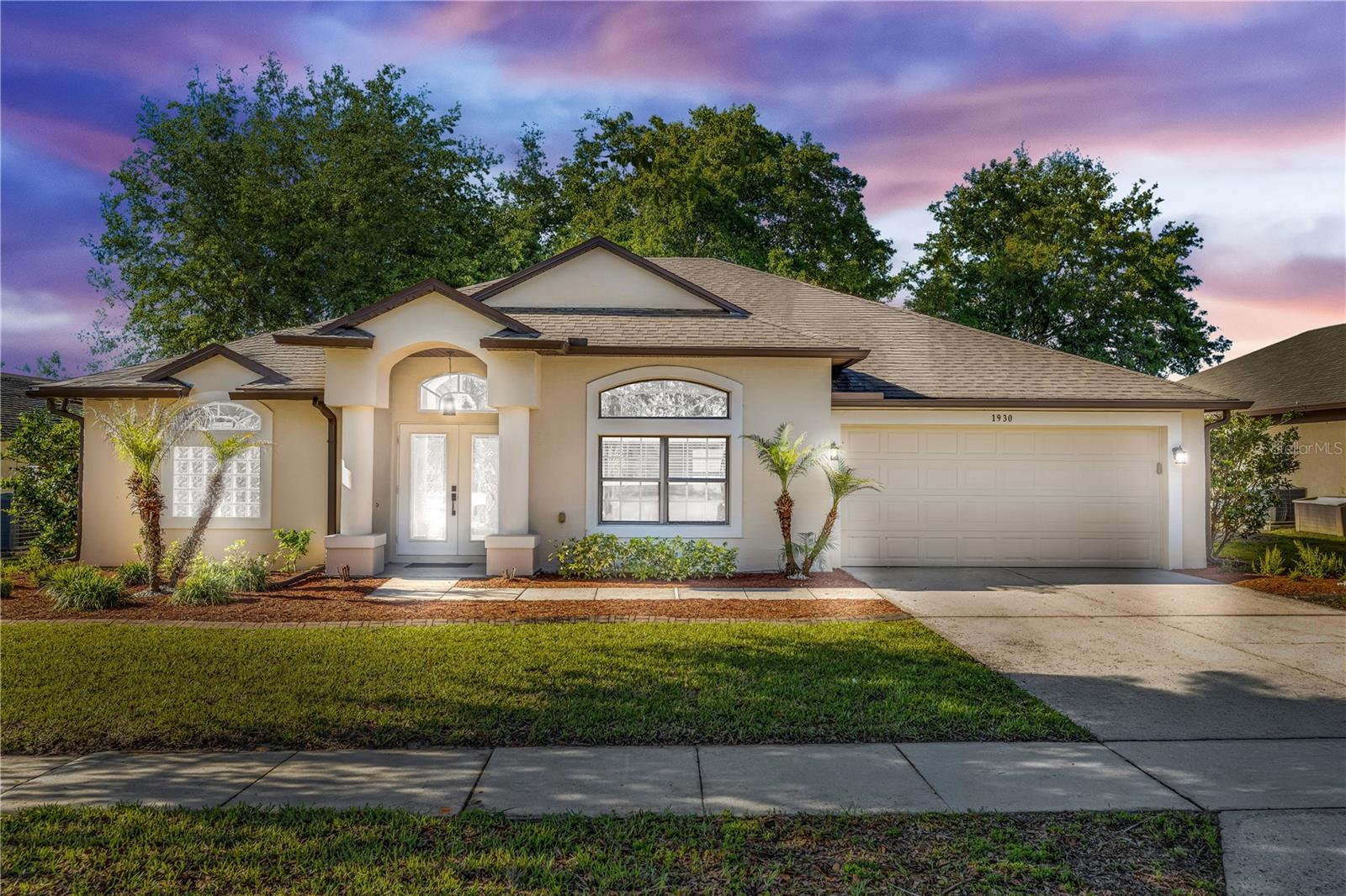 Welcome to this beautifully updated 3-bedroom, 2-bath home offering the perfect combination of modern upgrades, open-concept living, and Florida outdoor lifestyle. From the moment you arrive, you’ll notice the enhanced curb appeal, freshly painted, complete with gutters and a striking double glass door entry that sets the tone for what’s inside. Step into a light-filled interior featuring soaring vaulted ceilings and top-of-the-line 20 mil luxury vinyl plank flooring throughout, creating a seamless, modern aesthetic. The spacious living area is perfect for both everyday living and entertaining, with an open, airy floor plan buyers are searching for. The fully upgraded kitchen is a true showstopper, boasting quartz countertops, rich espresso cabinetry, stainless steel appliances, and a large center island—ideal for hosting, meal prep, and gathering with family and friends. The primary suite retreat offers vaulted ceilings, dual walk-in closets, and private access to the screened lanai. The spa-like ensuite features dual vanities with quartz countertops, a garden tub, and a beautifully tiled glass walk-in shower. Enjoy the best of Florida living in your private, fully fenced backyard with no rear neighbors, a screened-in porch, and plenty of space to relax or entertain. Additional outdoor highlights include an 8x10 storage shed and an irrigation system using reclaimed water for efficiency and savings. This home is packed with valuable upgrades including, NEW A/C (2024), ROOF (2020), interior laundry room with built-in cabinetry, and garage utility sink. Located in a desirable area close to shopping, dining, major highways, and top-rated schools, this home offers both convenience and comfort. Turnkey, upgraded, and ready for its next owner—schedule your private showing today! Home may be under audio or visual surveillance.