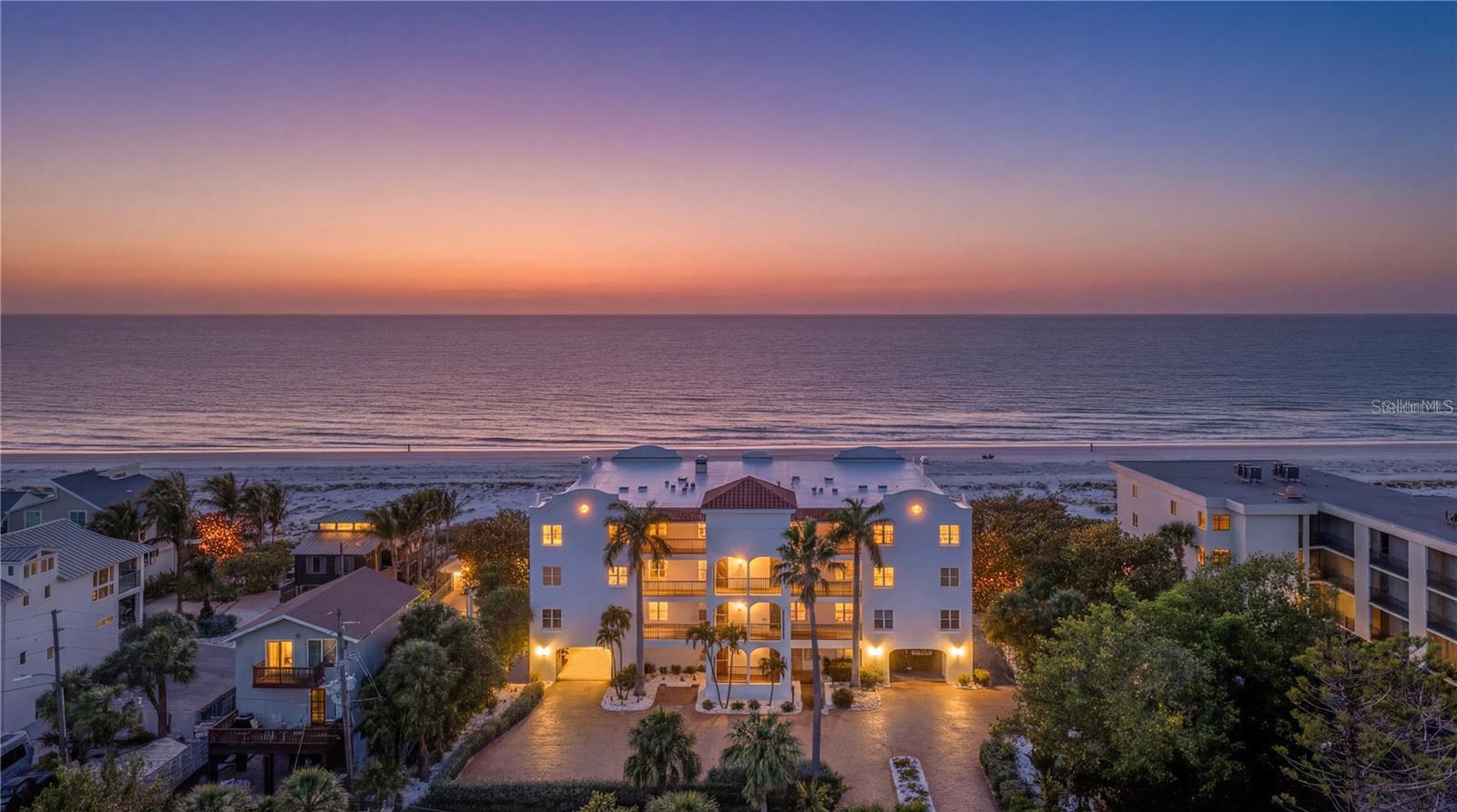 One or more photo(s) has been virtually staged. Welcome to Casa Playa, an exclusive nine-residence beachfront enclave where coastal luxury meets effortless living. This beautifully newly remodeled three-bedroom, three-bath home offers sweeping Gulf views from the moment you wake up in your serene primary suite setting the tone for each day. Enjoy morning coffee on your private terrace or in the sun-filled open living space, all with beach views and the soothing rhythm of the waves. Relax while waiting for the beautiful sunset or venture down your back stairs to the quaint private path to enjoy the quiet pristine sand beach and refreshing waters.  On your way, grab your beach chairs, kayaks and all the essentials to enjoy the day from your large storage space.  Or, take a very short stroll to the iconic Don Ceasar Resort and visit its restaurants and spa. With a membership, you can enjoy multiple pools and classes.
Designed for both refined living and effortless entertaining, the home features an elegant open-concept layout and a thoughtfully appointed kitchen, perfect for preparing fresh local seafood while gathering with family and friends. The inviting living area is anchored by a charming wood-burning fireplace, adding warmth and character to coastal ambiance.
Ideally situated, walking distance to the charming shops and restaurants of historic Pass-a-Grille, and just a short drive to the natural beauty of Fort De Soto Park and the vibrant energy of St. Petersburg. With convenient access to Tampa International Airport via I-275, travel is seamless. The property includes two parking spaces.