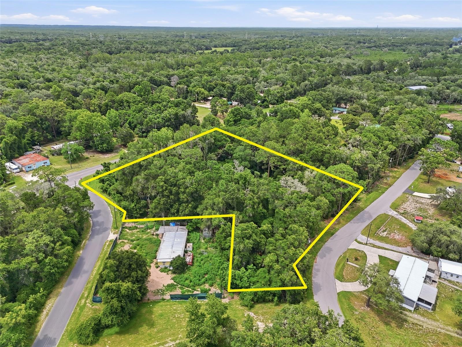 Discover the potential of this 1.80-acre corner parcel. Positioned with frontage on both Carl G. Rose Highway (CR-486) and Castlebury Road, this lightly brushed property offers excellent accessibility and visibility while maintaining a peaceful Nature Coast setting. Located in FEMA Flood Zone X, the property is outside of a designated flood hazard area, providing added peace of mind for future development.

Zoned MDRMH (Medium Density Residential / Mobile Home District), this parcel may offer opportunities for modular homes, manufactured homes, single-family residences, or potential subdivision possibilities, subject to Citrus County approval and buyer verification. Whether you’re looking to build your dream home, establish a family compound, or explore investment and development opportunities, this property provides flexibility to bring your vision to life.

Conveniently located near US-41, SR-200, and major area amenities, you’ll enjoy easy access to shopping, dining, healthcare facilities, and everyday conveniences. Outdoor enthusiasts will appreciate the property’s proximity to the Tsala Apopka Chain of Lakes, public boat ramps, fishing, kayaking, hiking trails, and the renowned Withlacoochee State Trail. The Gulf Coast’s boating, fishing, scalloping, and waterfront attractions in Crystal River, Homosassa, and Hernando Beach are approximately 30 to 40 minutes away.

Additional nearby destinations include Downtown Inverness, Citrus Memorial Hospital, Ocala, and the growing Citrus Hills area. Tampa International Airport, Ocala International Airport, and Orlando International Airport are all within reasonable driving distance, making travel convenient while still enjoying the relaxed Florida lifestyle.

Don’t miss this opportunity to secure a versatile 1.80-acre parcel in one of Citrus County’s growing areas. Buyer to verify all zoning, land use, subdivision potential, dimensions, and development requirements with Citrus County.
