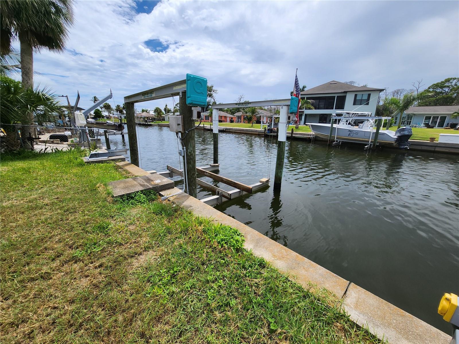 Gulf Access – No Bridges!

This choice sea walled lot offers direct and unobstructed deep-water access to Lemon Bay and the Gulf of America—no bridges! Enjoy quick and easy boating access right from your backyard.

Electric and water have already been run to the concrete seawall and wooden dock. A 13,000 lb boat lift is fully operational and ready for your vessel.

The existing home was damaged in the last hurricane and has been fully gutted, providing a blank slate. 
The detached garage has solid structure and can be used for storage or easily converted into an oversized laundry room or workshop.

This is a great opportunity to create your ideal waterfront retreat—whether you renovate the existing structure for a rental or vacation home, or tear down and build your dream home on the water