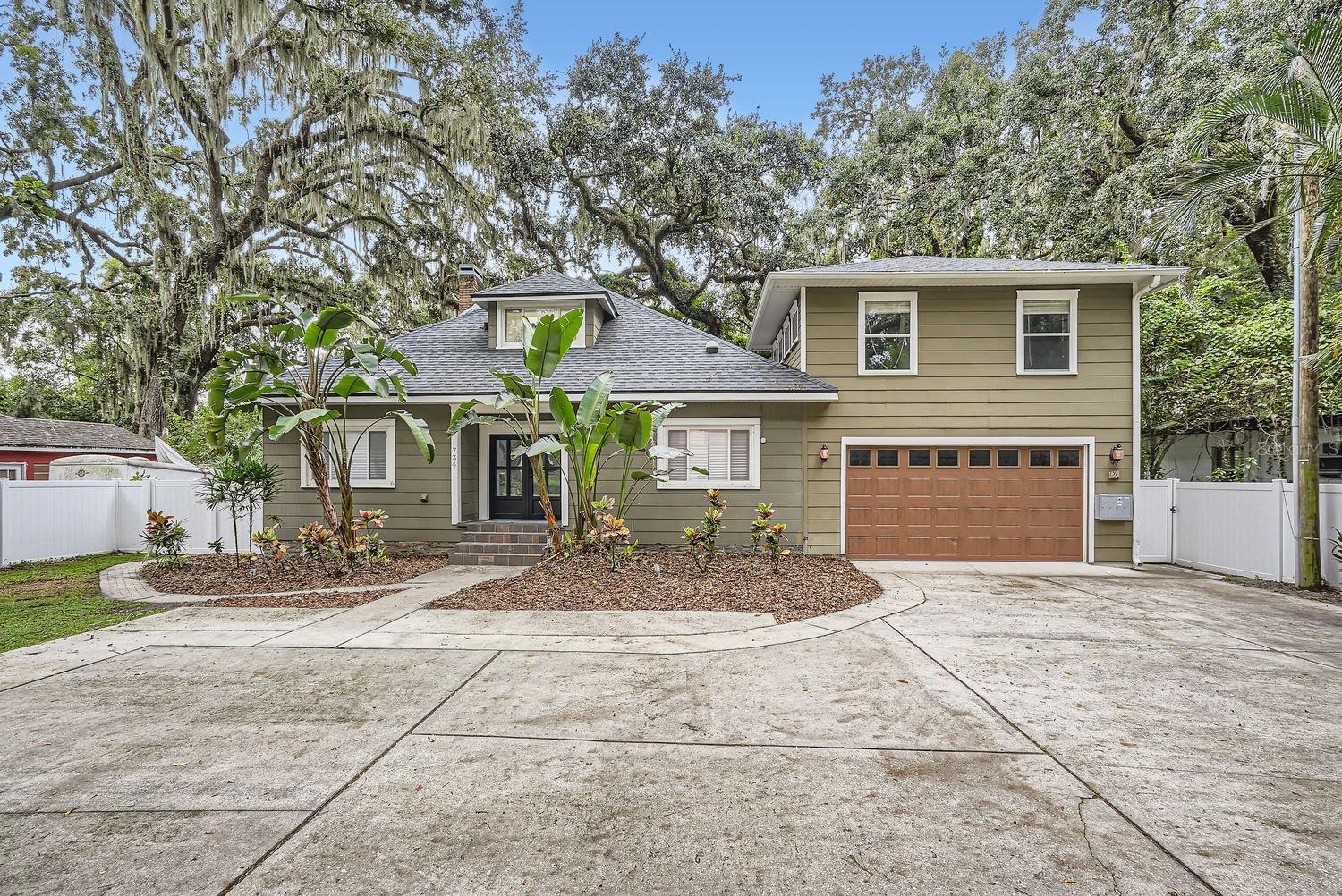This stunning 1918-built historic home at 734 S Mills Ave in Orlando, FL, has been thoughtfully and extensively remodeled into a versatile 7-bedroom, 5-bathroom residence offering approximately 3,320 sq ft under air and sitting on a generous 0.26-acre lot. Perfect as a primary residence with income potential or a turnkey investment property, it combines timeless charm with modern luxury. 

The main house features a brand-new gourmet kitchen with custom all-wood cabinetry (soft-close doors/drawers), luxurious marble countertops and floors, a fire clay sink with motion-sensor faucet, a 36” range with barn-door convection oven and built-in air fryer, counter-depth refrigerator, dual-zone wine fridge, and ultra-quiet dishwasher. New French oak flooring flows throughout, complemented by recessed WiFi-enabled RGB lighting, crown molding, Jeld-Wen solid interior doors, and a stylish Teza front door. Bathrooms are elevated with marble floors/tiles and a spacious freestanding soaking tub for relaxation. Additional highlights include cedar-lined upstairs closets, a private rear deck, and a 2-car garage. 

This property functions as a triplex with a fully renovated main house plus two attached apartments (a mother-in-law suite downstairs and another upstairs), both currently leased for immediate rental income. There’s also expansion potential with a loft buildout that could create an additional unit. Located in the desirable Delaney Park / Lake Davis area, it offers proximity to parks, dining, and downtown Orlando amenities while sitting on a quiet street with good walk/bike scores in parts of the neighborhood. 

Key Specs: 7 beds, 5 baths, 3,320 sq ft, built 1918 (renovated), 2-car garage, central AC/heat, listed around $989,900–$999,990 (recent price drop).