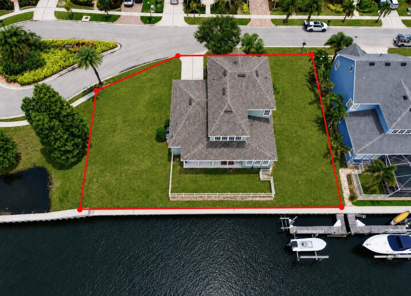 Direct Tampa Bay Access, Assumable 2.25% Interest Rate, Waterfront Living at Its Finest in MiraBay! Imagine ending every day with a sunset cruise from your own backyard. Perfectly positioned on a quiet cul-de-sac with 136 feet of saltwater frontage, this exceptional waterfront residence offers direct access to Tampa Bay, making it a dream come true for boating enthusiasts. Equipped with a 10,000-lb boat lift plus a dedicated Jet Ski lift, you'll spend less time trailering and more time enjoying the Florida lifestyle.
Built by David Weekley, this sought-after Sand Dollar floor plan offers an impressive 3,635 square feet with 4 bedrooms, a private home office, formal dining room, and the primary suite conveniently located on the first floor. Designed for both everyday living and entertainment, the expansive layout provides room for everyone to gather while still offering private spaces to work, study, or relax.
The heart of the home is the stunning chef's kitchen featuring wrap-around seating, soaring ceilings, abundant cabinetry, and newer GE Profile stainless steel appliances, including a 2025 built-in Advantium microwave/oven, 2021 refrigerator, and 2020 dishwasher. Natural light pours into the open-concept living spaces, highlighting the extra-long, extra-wide luxury vinyl plank flooring throughout the main level, while upgraded STAINMASTER carpet with memory foam padding adds comfort to the primary suite and second floor.
Step outside to an oversized waterfront homesite offering endless possibilities. With plenty of room to design your dream pool, the backyard is ready to become your own private waterfront oasis where family and friends can gather after a day on the water.
Major improvements provide peace of mind, including a new roof (2024) and new upstairs 3-ton, 15.5 SEER air conditioning system (2025), allowing you to move in with confidence. As an added bonus, qualified buyers may have the opportunity to assume the existing 2.25% interest rate.
Beyond the home, you'll experience the unmatched lifestyle of MiraBay, one of Apollo Beach's premier gated waterfront communities. Designed around the beauty of Florida's coastal living, residents enjoy an impressive collection of resort-inspired amenities including a spectacular clubhouse, zero-entry heated resort pool with waterslide, lap pool, state-of-the-art fitness center, café, tennis and pickleball courts, basketball courts, playgrounds, parks, miles of scenic walking trails, and year-round community events. Launch a kayak or paddleboard from the community launch, explore the neighborhood's interconnected lagoons, or simply enjoy peaceful evening strolls beneath swaying palms and waterfront sunsets.
Conveniently located near waterfront restaurants, marinas, shopping, I-75, Downtown Tampa, Tampa International Airport, award-winning Gulf beaches, and some of Florida's best boating destinations, MiraBay offers the perfect balance of luxury, recreation, and convenience.
Waterfront homes offering this combination of direct Tampa Bay boating access, premium updates, expansive living space, oversized homesite, resort-style amenities, and an assumable 2.25% interest rate are exceptionally rare. Schedule your private showing today and discover why 5709 Sea Trout Place is more than just a home- it's your gateway to the Florida waterfront lifestyle you've been dreaming about.