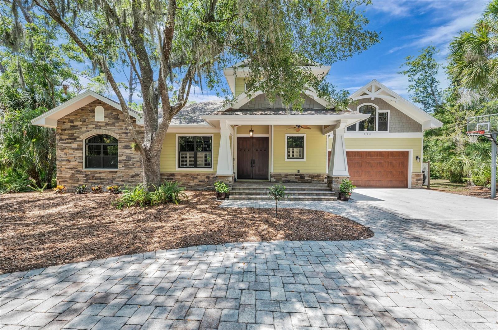 Welcome to your own private retreat in the award-winning community of River Forest, where timeless craftsmanship meets the beauty of Old Florida.

This custom-built 4-bedroom, 3.5-bath residence offers the perfect blend of luxury, comfort, and adventure. Designed for both everyday living and entertaining, the home features a dedicated office, spacious loft/game room, and an open, thoughtfully designed floor plan filled with natural light.

Step outside to your backyard oasis complete with a custom built pool, relaxing hot tub, and gas outdoor kitchen—ideal for hosting family and friends year-round. Beyond the lanai, launch your kayak or paddleboard from your own backyard and explore the peaceful creek leading directly to the Braden River, where fishing, wildlife, and unforgettable sunsets become part of your daily routine. 

Inside, you'll appreciate the quality construction and thoughtful upgrades including impact-rated windows and doors throughout, a gas range, gas tankless water heater, gas pool heater, and a hookup for a dual-fuel generator, all running off of a buried propane tank. Car enthusiasts and hobbyists will love the oversized 4-car tandem garage offering exceptional storage and workspace.

Residents of River Forest enjoy access to a community boat dock and take pride in living in one of the area's most distinctive neighborhoods. Renowned for its commitment to preserving Florida's natural beauty, River Forest has received numerous awards for its environmental stewardship, landscape design, and community planning.

This is more than a home—it's a lifestyle where nature, recreation, and exceptional living come together in one extraordinary setting.