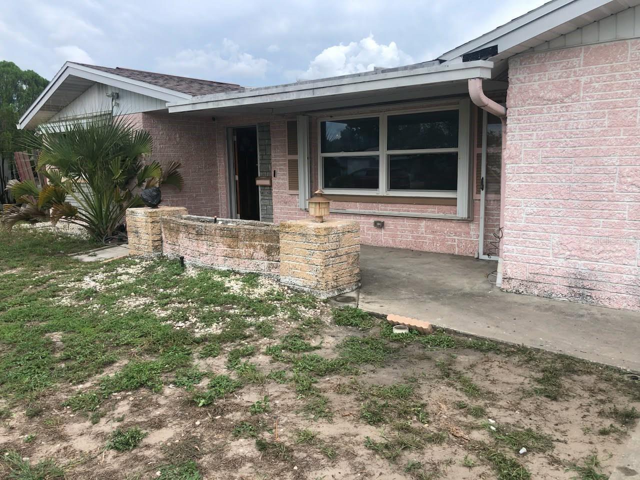 Won't last long!!!! Investor opportunity. 2bed, 2 bath and a potential for a 3rd bedroom. SOLD AS-IS!!!, this property presents an outstanding opportunity for personal residence or investors, flippers, buyers looking to create substantial equity. While the home requires an interior rehabilitation, several important capital improvements have already been completed, including a newer roof, newer hot water heater, storm windows, and storm shutters, providing a solid foundation for your renovation plans.

Situated on a desirable corner lot, the property offers a spacious backyard, an enclosed rear patio, and additional outdoor space with endless possibilities for entertaining, expansion, or storage. The 1½-car attached garage provides ample room for parking, a workshop, or extra storage.

Enjoy the freedom of no HOA or CDD fees while benefiting from a convenient location near shopping, dining, schools, and everyday amenities. Easy access to major highways makes commuting to Tampa and surrounding areas convenient, all while enjoying the charm of an established residential neighborhood.

Bring your vision and contractor—this property offers exceptional potential to transform it into a beautiful residence or a rewarding investment.