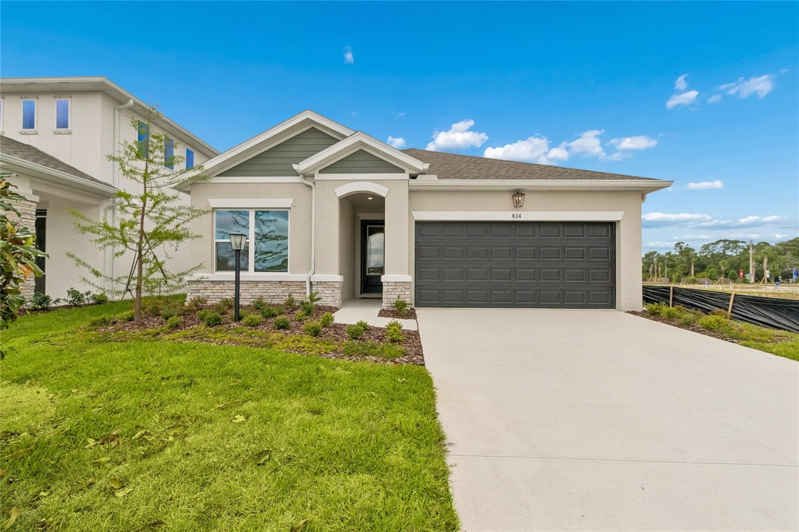 Discover the Sanborn by David Weekley Homes at Eastlyn in Bradenton, FL, where exceptional craftsmanship meets genuine everyday comfort. Located in this brand-new, no CDD fee community with convenient access to I-75, Eastlyn offers a charming neighborhood atmosphere that feels peaceful and welcoming while remaining close to major roadways and daily conveniences. Designed for both entertaining and unwinding, the Sanborn floor plan was nicknames, "The Gourmet Hub," because it showcases inviting family room and dining spaces that set the stage for everything from holiday gatherings to quiet evenings at home. At the heart of the home, the spacious gourmet kitchen features a large solid-surface island—perfect for preparing meals, hosting celebrations, or enjoying a casual snack while creating lasting memories. Front secondary bedrooms offer privacy for family members or guests, while the rear Owner’s Suite provides a serene retreat. This private space is highlighted by a spa-inspired Super Shower and an oversized walk-in closet, creating a relaxing escape at the end of the day. An extended covered lanai with 12' sliders gives you that extra living space outdoors, perfect for morning coffee or evening conversations under the Florida sky. Built with the quality and attention to detail David Weekley Homes is known for, every Sanborn home is backed by a comprehensive 1-2-10 Builder’s Warranty, offering long-term confidence and peace of mind.