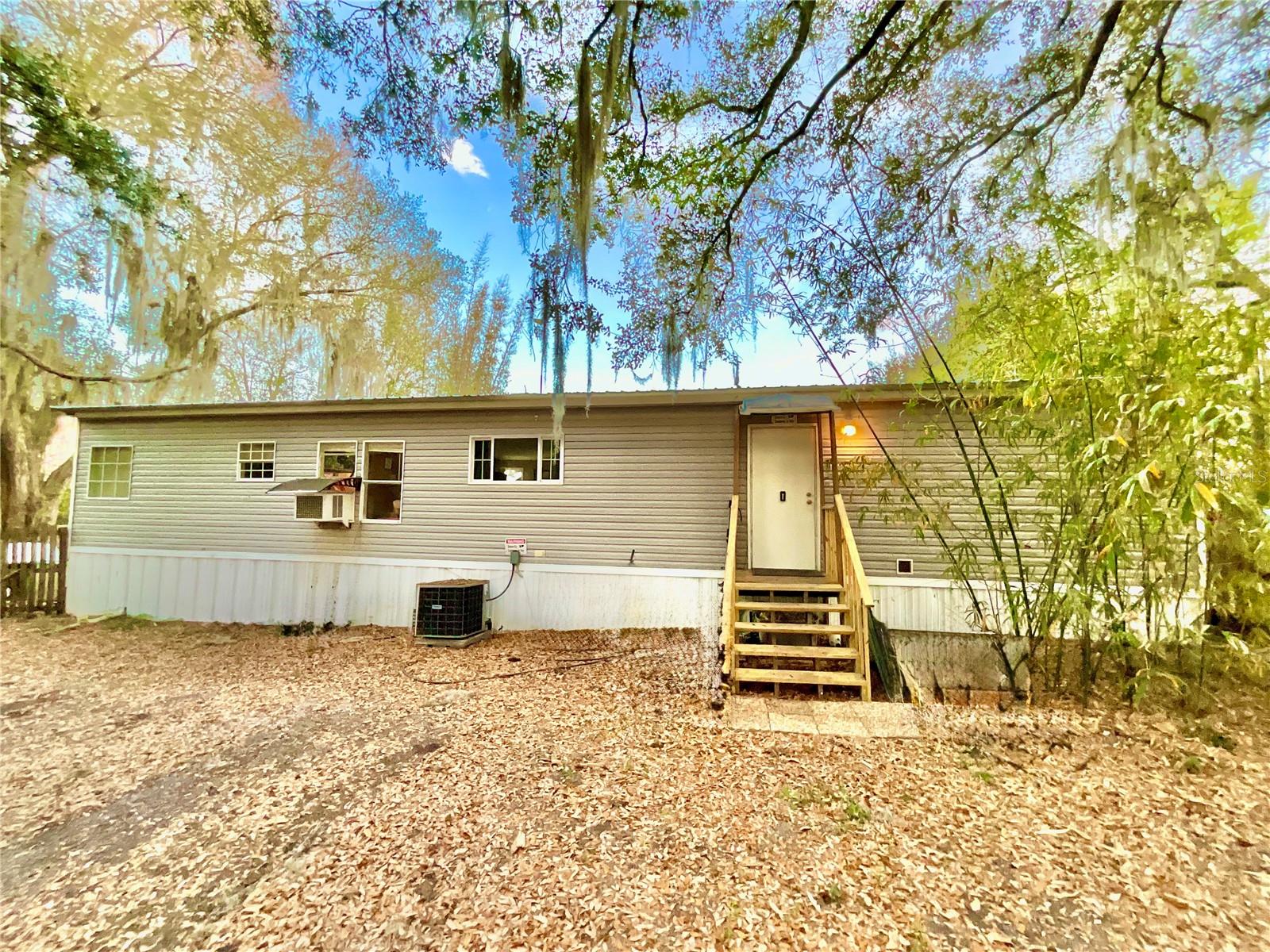 Beautiful Lake Front property on Cowpen Lake. Right in the heart of North Central Florida in the area known as The Lake Region is this cozy 2010, 3 Bed, 2 Bath manufactured home. Perfect for a big family or to make your own private retreat. Plenty of room for all your vehicles and toys. There is a 20’x 30’ concrete slab and an included uninstalled 18’x 30’ carport. This 1.7 acre property is located on Cowpen Lake, known for its clearwater. A fully recreational lake where you can enjoy Fishing, Swimming, Skiing, Kayaking and more. Right on State Road 20. The properties location is an easy commute between Gainesville, Palatka, and Ocala. Even the Historic Town of Melrose is nearby for eating out, cultural actives, vendors, art walks, regular music events and so much more.