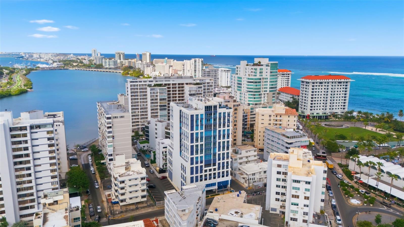 One or more photo(s) has been virtually staged. 14 Delcasse Street | Condado Blu – Penthouse Model Unit
Brand-new penthouse model residence at Condado Blu, never lived in and completed in 2024. This west- and north-facing unit offers 3 bedrooms, 3.5 bathrooms, and 3,044 total square feet of thoughtfully designed interior and exterior living space.
The apartment features floor-to-ceiling windows with panoramic views of the Atlantic Ocean and Condado Lagoon, filling the space with natural light and sunset views. The modern kitchen is equipped with GE Monogram appliances, a wine refrigerator, and a custom-built pantry, seamlessly connecting to the main living areas. A dedicated laundry room, custom-built closets, and motorized window treatments with both sheer and blackout curtains enhance comfort and functionality.
The residence is partially furnished and includes a comfortable balcony/terrace ideal for indoor-outdoor living. Additional features include a full power generator, water cistern, storage unit, and four deeded parking spaces.
Condado Blu offers resort-style amenities, including two rooftop jacuzzis, private gym, chilled wine cellar with designated storage, outdoor rooftop bar lounge, visitor parking, and 24/7 concierge service.
A rare opportunity to own a turnkey, never-occupied penthouse in one of Condado’s most modern luxury developments.