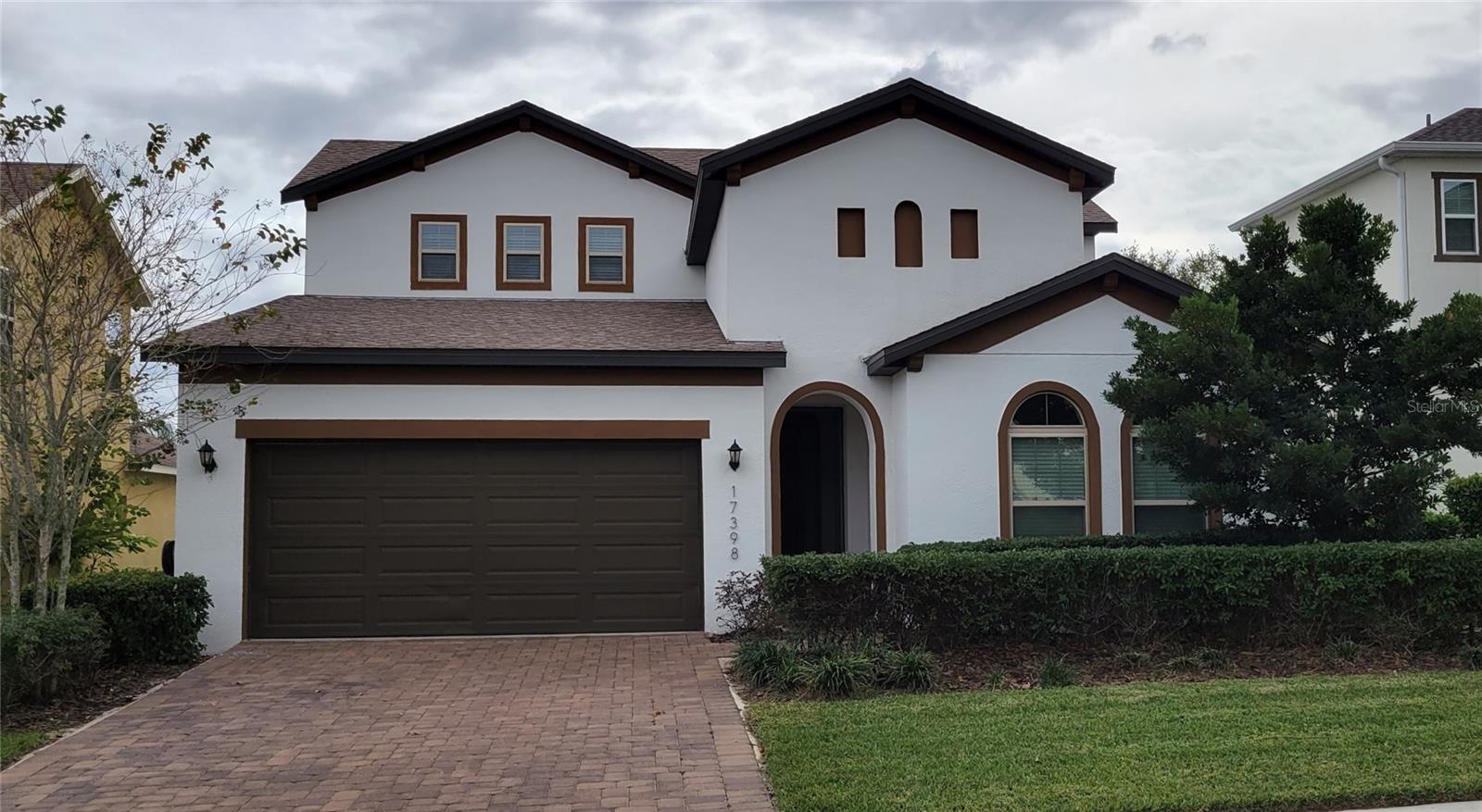 arge 4-bedroom home + 2 large Bonus rooms. This 2782sf 4-year-old home is in the awesome community of Lakeside just west of the Winter
Garden Village about 4 miles. The home has tons of space, humungous kitchen and Master bedroom downstairs along with bedroom #2 and 3,
and with a full bath. The first floor is gorgeous tile from the front door throughout up to the bedrooms. Coffered details in high ceilings, arched
openings and a back yard looking over a peaceful treed conservation area. This Hampshire plan has a split plan with 2 bedrooms and full bath
near the front of the house first floor. Walking past the flex room that can be used for formal dining, office, etc to the main open living area with
living, dining, and kitchen. The kitchen is very large with TONS of tall 42 inch raised panel cabinetry and walk-in pantry. The beautiful light brown
granite is accented by medium Brown cabinets and all stainless-steel appliances with the stove fueled with gas. A walk-in pantry and Island sink
with breakfast bar look out to the open living room and dinette. Dinette has large windows on 3 sides to embrace the outside nature. The main
living area has a 3-panel slider door to open wide to the paved, covered Lania that overlooks a good-sized back yard with a nature conservation
overlook, all fenced in. Past the living room through the arched entry into the large primary bedroom. Ceiling fan and high coffered detailed
ceilings and a huge bath with a seated walk-in shower separating two individual vanities on large cabinets for lots of storage. Large walk-in
closet, separate toilet room, and linen closet. Washer and dryer have their own room near the garage. Take a quick step upstairs to a HUGE open
loft, 4th bedroom and 3rd full bath. full bath. This home has a 2 car garage and gas heated Tankless water heater. This home is located in the
awesome community of Waterside at Johns lake, with an incredible huge pool lakeside, playground, dock, clubhouse, state-of-the-art fitness
center, and Dog area will make you feel like you’re on vacation. With tree lined streets, walking paths along the lakes, benches, and picnic tables
and BBQ grills, all to embrace nature at every turn. Located just a few minutes from Winter Garden Village and the 429 and turnpike.