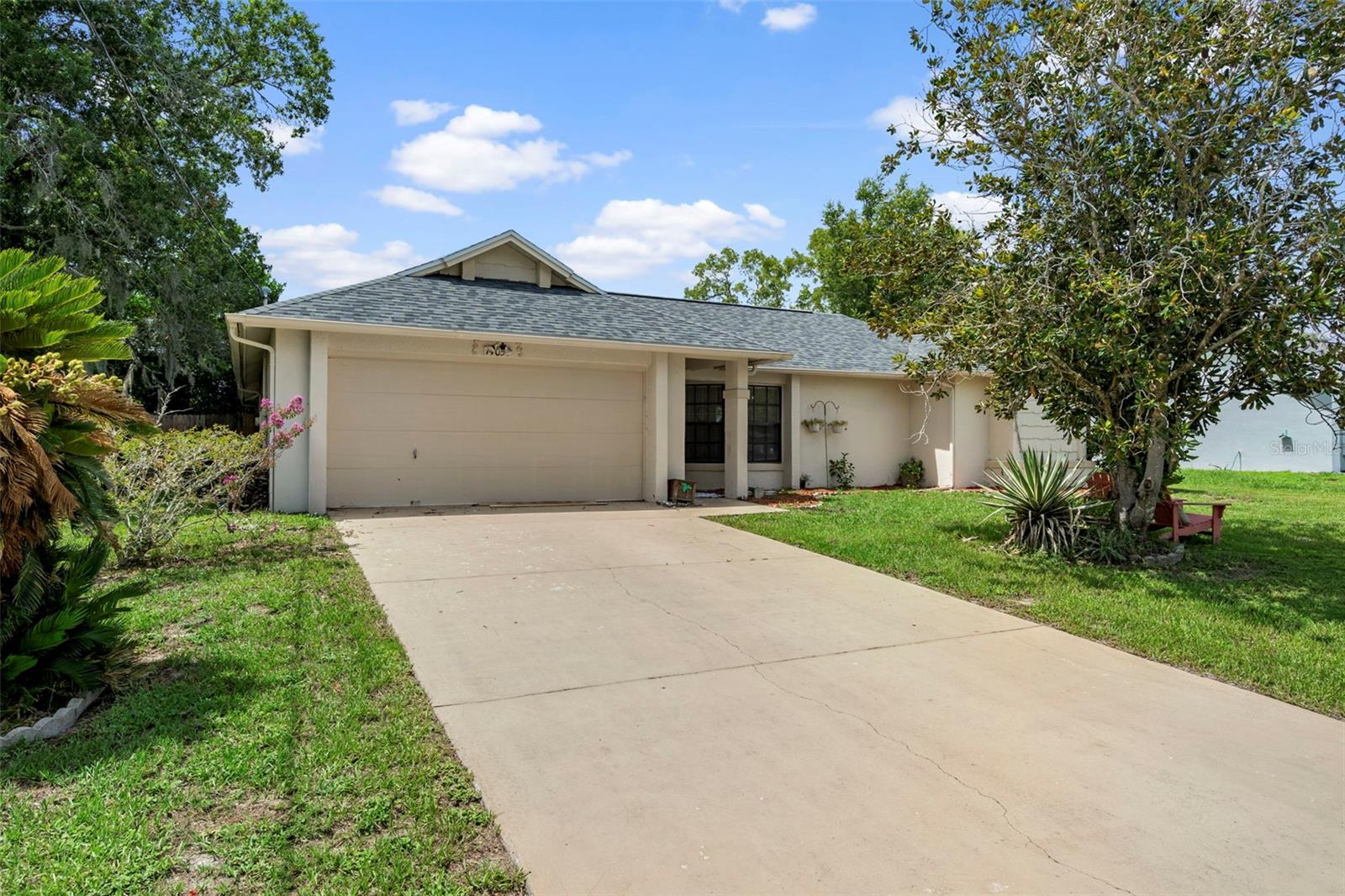 Virtually Staged. Check out this 3 bed, 2 bath, 2-car garage home with a Split Bedroom Floor Plan and Wonderful Layout. Living Room plus an additional Den to ensure privacy inside the home. Roof 2025. Water Heater 2016. Modern Style Flooring updated in 2019 in the Living Room, Den, and All Three Bedrooms. Walk in closets in each bedroom. Backyard is privately fenced in with your ABOVE GROUND POOL. Spacious Patio to sit out on those beautiful sunny, Florida days. Nice, quiet street that is highly convenient to grocery stores, shopping, restaurants, medical centers, and many other amenities. Less than 5 minutes to the Suncoast Parkway/589 with seamless access to Tampa, Clearwater, and St Pete.