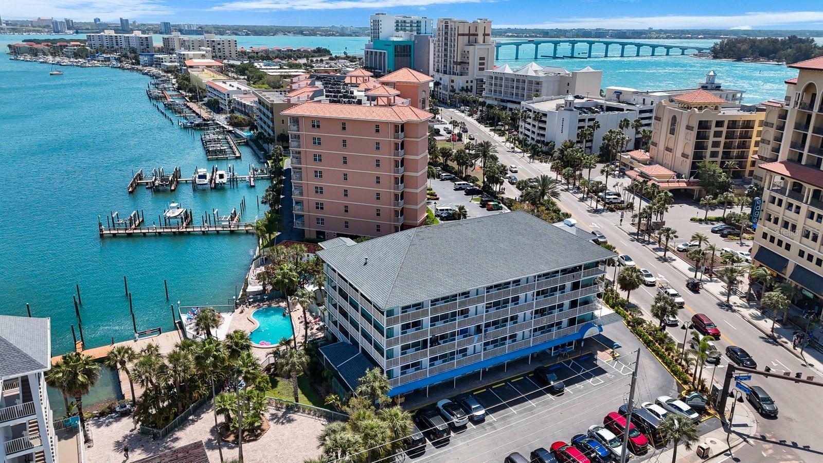 Fantastic Clearwater Beach investment opportunity — high-visibility waterfront hotel with monument street sign. Five-story property offering 66 income-producing units, waterfront pool, private dock, and off-street parking. City-approved plans for additional commercial space add redevelopment upside( to be verified with the city). Prime location steps from dining, shopping, beach access and area attractions. Ideal for hotel owner-operator, redevelopment or mixed-use conversion. Sold AS-IS. Buyer to verify all facts, measurements and entitlements.