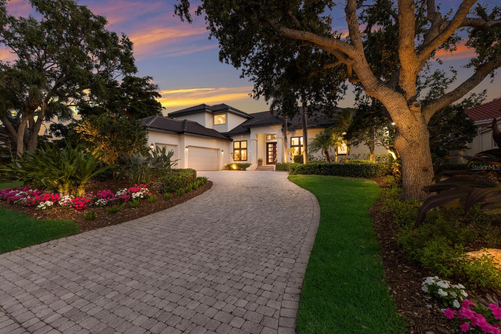 Just Announced: Major Price Improvement! An incredible opportunity awaits with this newly reduced price on one of Longboat Key’s most stunning, fully renovated homes! Don’t miss your chance—this pricing may not last as we head into peak selling season this fall and winter.
Experience this exceptional home for yourself! - Step into a world of refined elegance, where no detail has been overlooked in this Stunningly Renovated Estate in the exclusive, gated enclave of Sabal Cove, nestled behind the gates of the Longboat Key Club's Bay Isles community. Originally sold in 2021, this residence has since undergone a transformational, high-end renovation totaling over $850,000, blending timeless architecture with modern sophistication and comfort. Privately set at the end of a stately paver driveway, the home welcomes you with a custom-designed front door, new impact resistant front windows, outdoor lighting, and lushly manicured grounds that set the tone for the luxury within. Inside, you'll find stone flooring, designer wall coverings, and an impressive blend of Restoration Hardware and Hubbardton Forge lighting throughout. The spacious and thoughtfully designed layout offers soaring ceilings, sunlit living spaces, and seamless indoor-outdoor flow—ideal for entertaining or relaxing in your private sanctuary. The heart of the home is the newly customized chef’s kitchen, complete with high-end cabinetry, pendant lighting, updated hardware, and premium appliances, including a primary dishwasher and kitchen perimeter lighting system. The adjacent family room, re-tiled and reimagined, is perfect for casual living or formal gatherings alike. The primary suite is a true retreat, boasting luxurious custom closets and a spa-inspired bathroom featuring Waterworks Candide freestanding tub, marble slabs, designer hardware, and tailored finishes. Each guest space offers privacy and sophistication, including a beautifully updated guest bath with new tile, cabinetry, and hardware. Outside, the resort-style pool area has been fully upgraded with a new heater, pumps, controller, and remote system—all designed for efficiency and ease. A FireMagic grill and custom vent hood anchor the outdoor kitchen, creating the ultimate al fresco experience. Additional highlights include a new 5-ton A/C unit, updated plumbing, roofing, flooring, and electrical systems, a spacious 2-car garage with additional golf cart space, custom office shelving, built-ins, and a whole-house generator. As part of the Bay Isles community, residents enjoy deeded beach access, 24-hour manned gates, and the opportunity for Longboat Key Club membership, which includes golf, tennis, fitness, dining, and marina access with deep-water slips nearby. This is more than a renovation—it’s a reinvention of elevated island living. Discover the rare opportunity to own a move-in-ready, custom-upgraded estate in one of Longboat Key’s most sought-after neighborhoods.