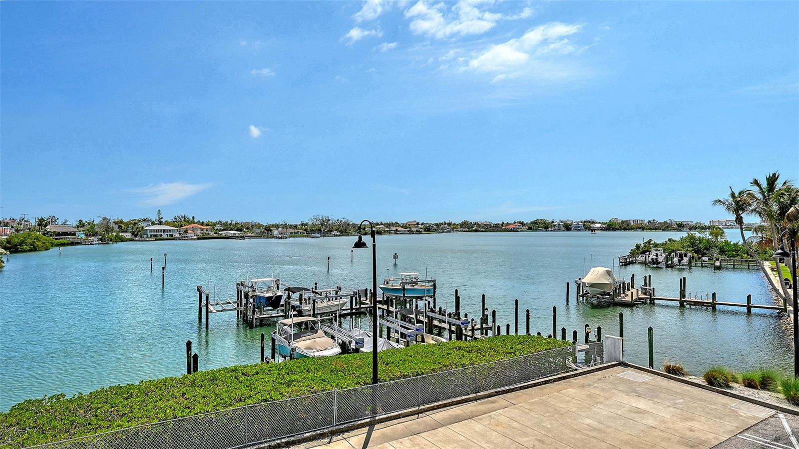 BOATER'S DREAM!  If you're a boater and looking for great waterfront views, this is the home for you! 5 minutes by water to the Venice Inlet at the Gulf with NO Bridges. Beautifully updated with unbelievable views of Dona Bay, this waterfront condo is the perfect combination of (did I say views?), Dona Bay, Intercoastal Waterway, & Gulf access. Looking over Dona Bay, which leads directly to the Gulf, is the huge covered front porch, kitchen, living, & dining rooms. You'll love having your boat only steps away ready to launch from your deeded dock with 10,000 pound, recently installed lift. The home also has two deeded parking spots in the enclosed, first floor garage with private elevator access into this home. Listed to sell quickly, this waterfront home is unbelievably nice & will absolutely overwhelm you. Call before it's gone for your own private showing.