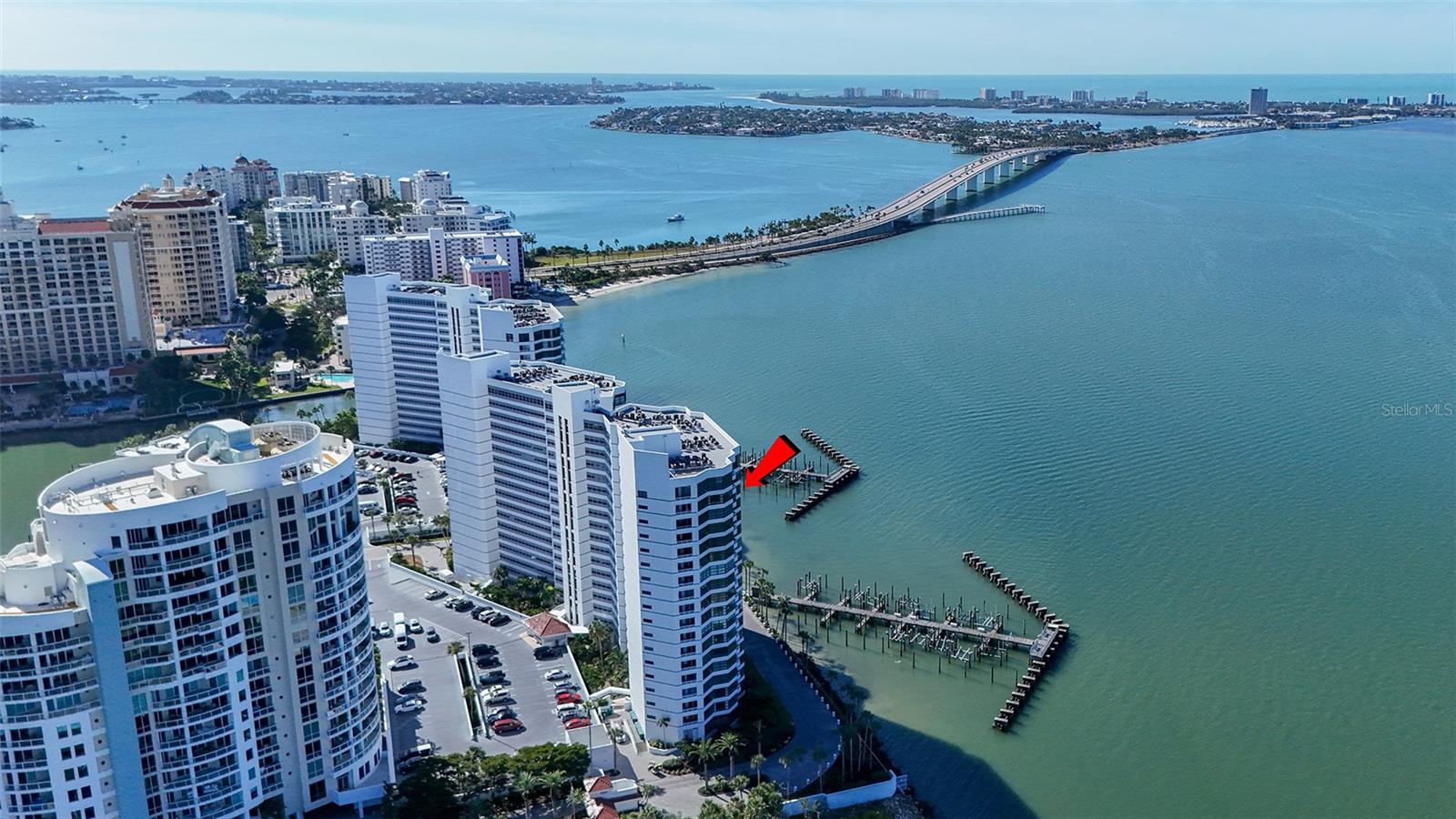 18th-Floor Luxury with Panoramic Bay Views:  Unobstructed Sarasota Bay views await from this 18th-floor double residence—one of a kind in Condo on the Bay. With nearly 3,300 sq. ft. of refined living space, two balconies, and two garage spaces, this home combines rare scale, sophistication, and breathtaking vistas.  The expansive layout features three bedrooms, three baths and a bonus room--all framed by sweeping water views. The gourmet kitchen boasts granite countertops, custom cabinetry, and premium paneled appliances.  Refined details include hardwood floors, crown moldings, coffered ceilings, custom woodwork and wine refrigeration. The primary bedroom includes two large walk-ins and its own sunset balcony.  Set within a 24-hour guard-gated community with a concierge receptionist, residents enjoy two bayfront pools, fitness centers, tennis and pickleball courts, concierge service, a social lounge, and rentable boat docks. Perfectly positioned in downtown Sarasota—steps from The Bay park, the Van Wezel Performing Arts Hall, the Ritz-Carlton, St. Armands Circle, and the soft sand of Lido Beach—this is luxury coastal living at its finest.