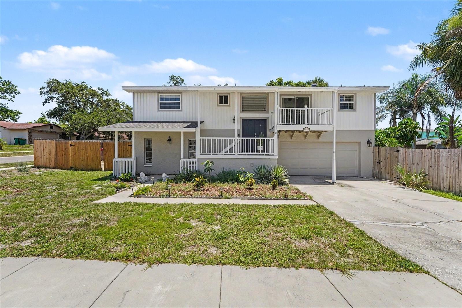Experience the ultimate coastal lifestyle in the highly desirable, golf-cart-friendly community of Blue Jay Woodlands! This unique 4-bedroom, 3-bathroom split-level home sits on an oversized corner lot and offers the boating lifestyle without the heavy price tag. A residents-only boat ramp providing direct Gulf of Mexico access is located just 0.1 miles away, and the property features built-in enclosed boat/toy storage.

The flexible floor plan showcases a spacious living room with a wood-burning fireplace, vaulted ceilings, and a private ground-level suite complete with its own entrance—ideal for multi-generational living or rental potential. Major systems offer total confidence with a 2021 roof, 2021 HVAC, and EV charging. Step outside to your private, fully fenced backyard oasis featuring a saltwater pool and a covered patio. Enjoy low HOA fees and quick access to the Pinellas Trail and pristine Gulf beaches!