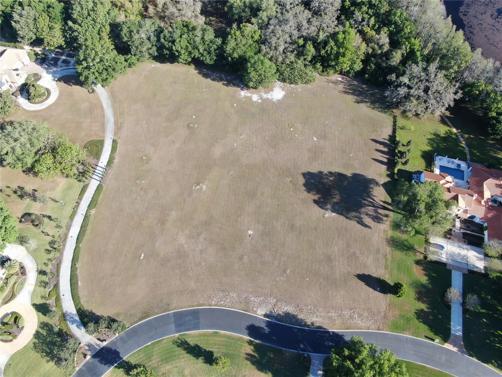 Look no further if you're searching for a prestigious community to build your custom dream home. This impressive 3.75-acre lot, the largest in Odessa's Stillwater, is now available for sale. Located within a highly sought-after gated community, Stillwater is a 24/7-guard gated community with all utilities underground. It is a country estate-type community whose guidelines ensure that all homes in Stillwater will be as elegant as the home you build. Moreover, Stillwater offers the convenience of municipal water and sewer, distinguishing it from other developments in the area that rely on well and septic systems. Additionally, Stillwater features a master propane distribution system, resulting in minimal propane gas costs, as rates are based on the entire community. With this remarkable combination of features, you can envision and construct the home of your dreams in this idyllic setting. Take advantage of this incredible opportunity to own this picturesque land and begin planning your perfect sanctuary today. Don't hesitate—just call ahead of time to explore this wonderful lot and community firsthand!