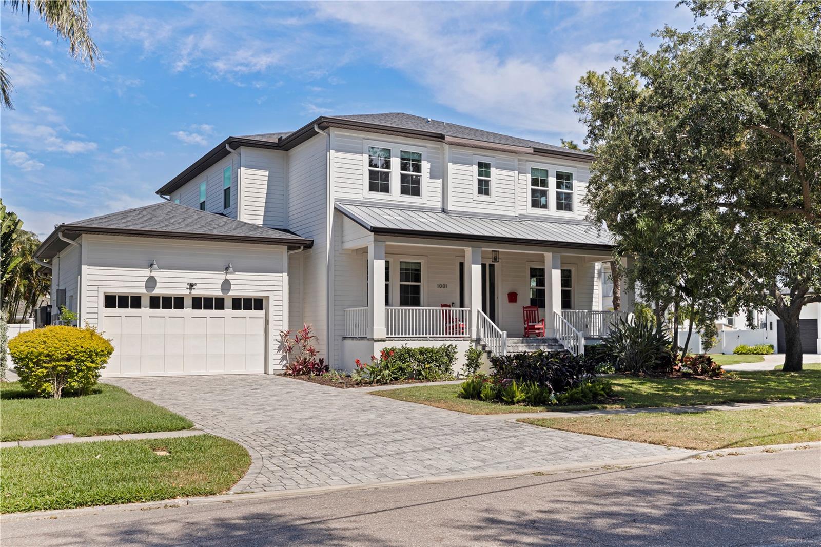 Situated minutes from downtown St. Petersburg, this beautifully designed home on exclusive Snell Isle offers space, style, and easy living. With a private pool, putting green, and inviting front and back porches, it’s perfect for relaxing or entertaining.  Inside, hand-scraped wood flooring adds warmth throughout. The main level features a spacious dining room, office/den, powder bath, and an expansive great room flowing into a stunning kitchen. The oversized kitchen includes quartz countertops, Wolf and Sub-Zero appliances, custom cabinetry, a butler’s pantry, and great storage.  Also downstairs is a guest bedroom with a full en-suite/pool bath, plus a laundry room.  Upstairs offers four large bedrooms, three full bathrooms, and a second laundry room. The primary suite is a private retreat with custom his-and-hers walk-in closets and a spa-like bath with quartz countertops, a freestanding tub, and a large walk-in shower. Enjoy expansive front and back porches—perfect for sunrise and sunset in one of St. Pete's most sought-after neighborhoods.