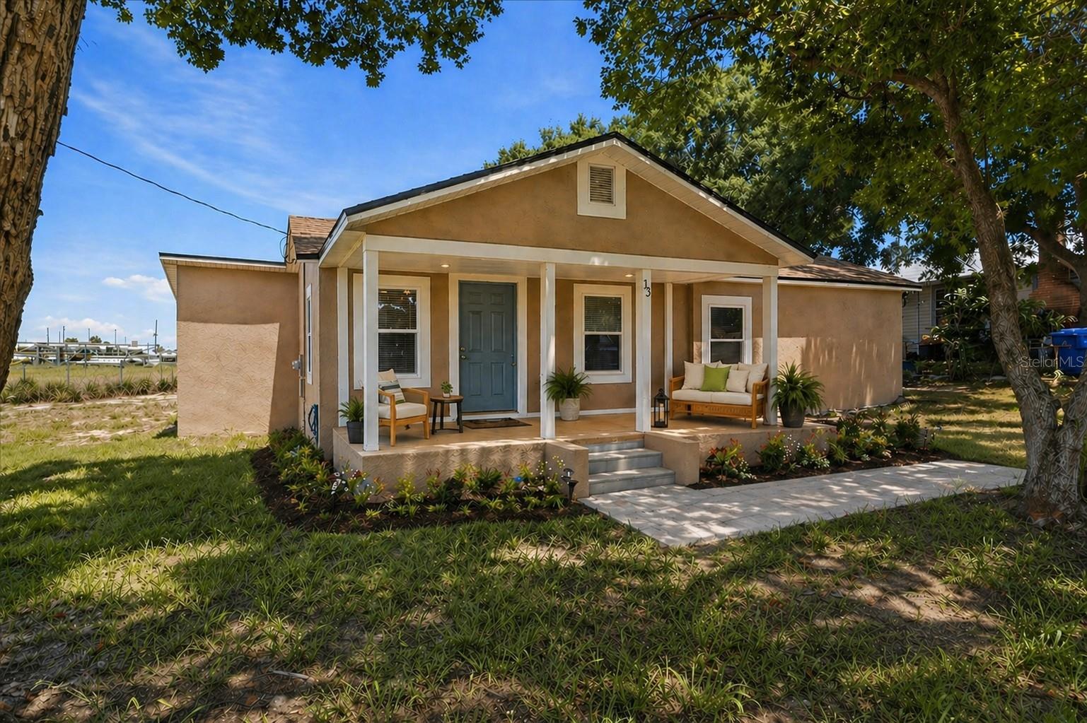 Virtually Staged. Situated on a spacious .31-acre lot with no HOA and no rear neighbors, this property offers the space, privacy, and freedom you've been searching for. This 3-bedroom, 2-bathroom home, originally built in 1946, has undergone a complete transformation with extensive updates completed in 2024, including the roof, windows, electrical, plumbing, insulation, AC and a new water heater installed in 2025—creating a move-in-ready home designed for durability, function, and long-term living. Interior and exterior paint were also completed in 2024, adding to the home’s clean, refreshed appearance. As you approach the front door, you’re welcomed by a covered front porch—perfect for a quiet sitting area and easily screened in for year-round enjoyment. Step inside and the home immediately feels open and easy, filled with natural light. Luxury vinyl flooring runs seamlessly throughout, complemented by recessed lighting that ties the space together and enhances the overall feel. The kitchen flows seamlessly into the dining area, featuring quartz countertops, shaker cabinetry with soft-close features, a lazy Susan, and brand-new appliances—bringing together simple, practical touches for everyday living. The former back porch has been converted into an enclosed laundry room, adding functional interior space while keeping daily tasks tucked away. Both bathrooms have been updated with finishes that keep the look consistent and fresh, adding to the overall feel of a home that’s been carefully brought together. Step outside and experience the privacy and open space that make this property stand out. With no rear neighbors and room to breathe, this is where quiet mornings and peaceful evenings become part of your everyday lifestyle. Located in the friendly city of Frostproof, you’ll enjoy a slower pace of living where small-town charm, local shops, and a strong sense of community create a lifestyle that feels more intentional and connected. Nearby lakes such as Lake Clinch and Lake Buffum providing opportunities for fishing, boating, and enjoying Florida’s natural beauty, while surrounding cities provide easy access to dining, shopping, and entertainment. Lake Wales is approximately 15 minutes away, Avon Park about 20 minutes, Sebring roughly 30 minutes, and Winter Haven about 35–40 minutes. For those needing access to larger destinations, Orlando is just over an hour away and Tampa is about an hour and a half, giving you the best of both worlds—peaceful living with access to Central Florida’s top attractions. A recent 4-point inspection wind mitigation and survey are available. **Short Term rentals are allowed but would have to register with Frostproof Business Tax Receipt for a business as Airbnb**