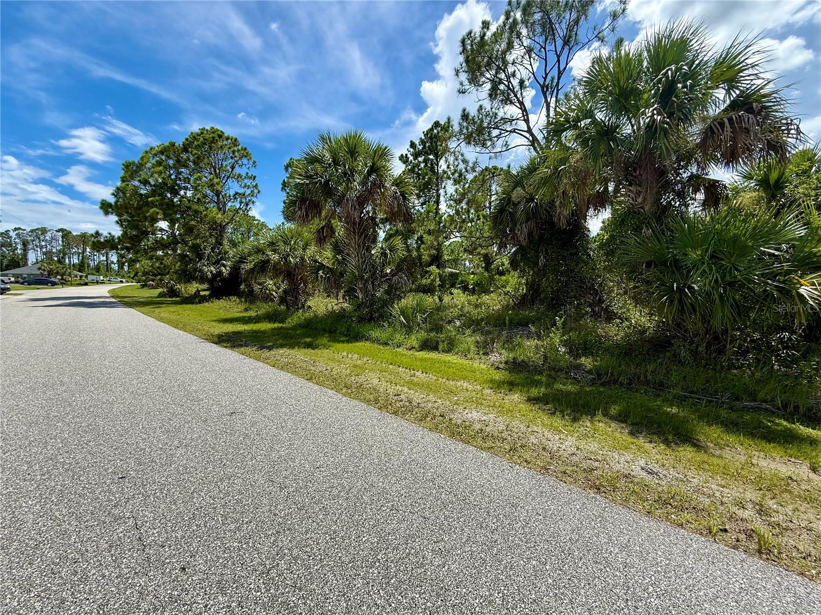 Looking for that perfect piece of land to build your slice of paradise on? Here's a great lot in this up-and-coming area of North Port! NO flood insurance required, save money and build with confidence!!!  Electric nearby, and no need to worry about mitigating Scrub Jays as property is NOT located in a habitat. Bring all your toys...store your RV, boat, kayaks, put up a detached garage, shed for an art studio, trampoline, or treehouse, doesn't matter as this is a non-deed restricted area of Sarasota County! And of course, what could be more Florida than having your own pool which the property has plenty of room for! Property is close to all amenities including sandy beaches & crystal waters of Venice, Englewood & Boca Grande Beaches, Golf Courses, boat launches, minutes from TWO Spring training Stadiums, the Rays & the Braves who hosts games against the Yankees, Red Sox, Mets & more. Have local builder with floorplans of 3 bedroom 2 bathroom homes with 10’ ceilings, 8’ doors porcelain plank flooring throughout, Quartz/Granite, lighting & fans, appliances, Impact windows…all-inclusive pricing starting at $320,000.