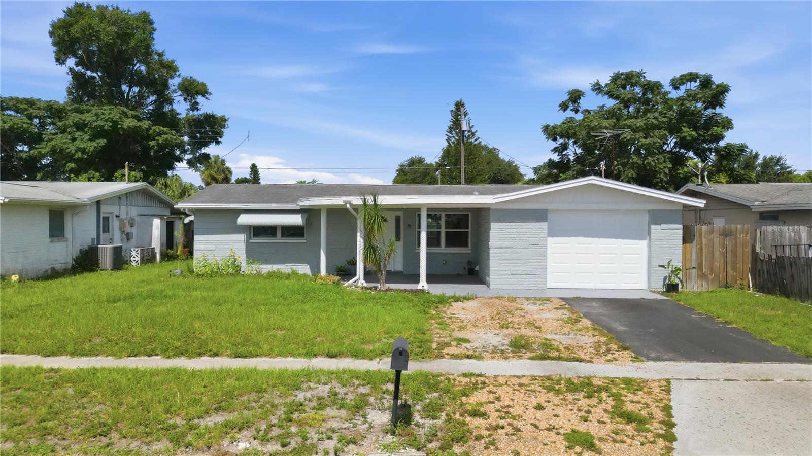Welcome to this well-maintained home in Holiday offering NO HOA and numerous major updates! This property features classic terrazzo flooring, a fully fenced backyard, and a screened lanai, providing the perfect space to relax or entertain.

Several windows and the sliding glass door have been upgraded to energy-efficient double-pane glass, enhancing comfort and efficiency. The spacious 1-car garage includes an additional bathroom, offering added convenience, storage, or workspace potential.

Major improvements include a 2023 HVAC system, 2018 electrical panel, 2017 roof, and 2017 water heater, giving buyers added peace of mind. The septic system was just inspected and pumped out in October 2025.

Conveniently located near shopping, restaurants, parks, beaches, and major roadways, this move-in-ready home is a fantastic opportunity for first-time buyers, seasonal residents, or investors. Schedule your private showing today!
