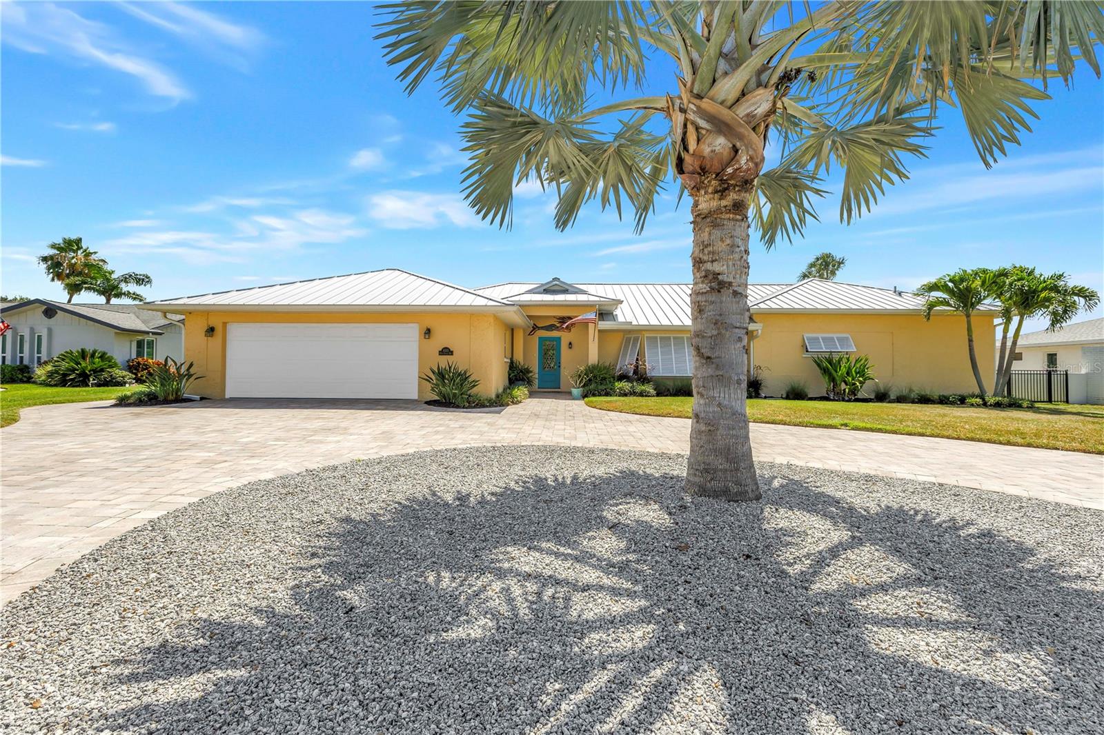 Your exclusive opportunity awaits at the Fairways at El Conquistador Parkway.  This meticulously maintained, and recently remodeled, coastal contemporary home boasts some of the best views of the community.   If relaxing is the order of the day, enjoy panoramic views of the IMG Golf Course 10th fairway from the large screen enclosed travertine lanai with large saltwater pool and covered area for dining. The fenced rear yard offers room for your family or fur babies and features a paver pad for telescope use or add a firepit for evening enjoyment.  Enter into this designed home thru the welcoming foyer and step into chef's kitchen with all wood cabinetry, GE Cafe stainless steel appliances and a large marble island with waterfall edge.  Entertain in the combined living room/dining room with easy care ceramic tile flooring and large windows and French doors letting in both the morning and afternoon light. 
This customized and expanded home offers a split floor plan with two oversized primary bedrooms, each with its own sitting room area and ensuite bathrooms and walk-in closets.  A third guest bedroom is conveniently located next to a full guest bath with granite counter, dual sinks and walk-in shower. The interior laundry room houses washer, dryer, sink and storage space. 
The spacious 3 car garage has epoxy finish flooring, a side load golf cart door, and plenty of space for storage shelving and your water toys. The circular driveway can house multiple cars as well. 
Have peace of mind with all of the windows and doors being impact rated and the kitchen pass-thru having a roll-down shutter.  A newer metal roof and whole house propane generator offers additional comfort.
This location is a must see!  The finishes are designer quality, there is no HOA and the homesite is one of the largest in the community.