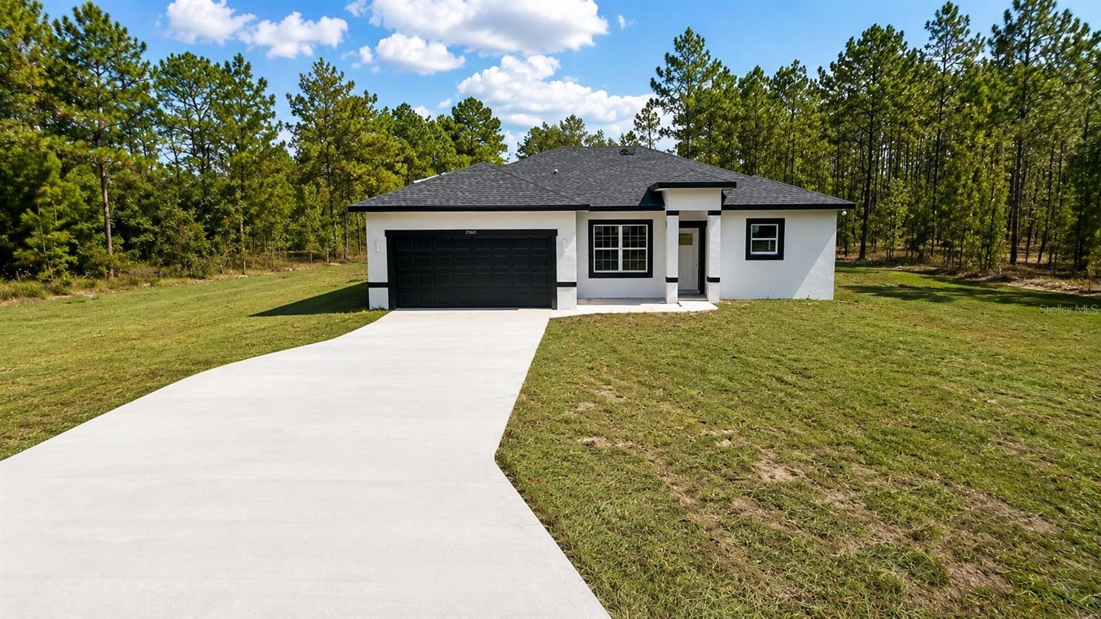 Under Construction. Brand-new house in Rainbow Lakes Estates! This stunning home combines modern style and convenience with 4 bedrooms and 2.5 bathrooms. The master bathroom is a true retreat, featuring a stunning STANDALONE TUB and a sleek SHOWER DOOR for added style and functionality. The spacious open floor plan is perfect for hosting large family gatherings, and the fully equipped kitchen includes stainless-steel appliances—refrigerator, range, disposal, dishwasher, and microwave, along with a stylish WATERFALL ISLAND that adds a touch of elegance. Additional features include a SMART KEY system for enhanced security and the peace of mind that comes with a 2-10 HOME BUYERS WARRANTY. Don’t miss out—schedule a showing today! (Photos refer to the model home.)