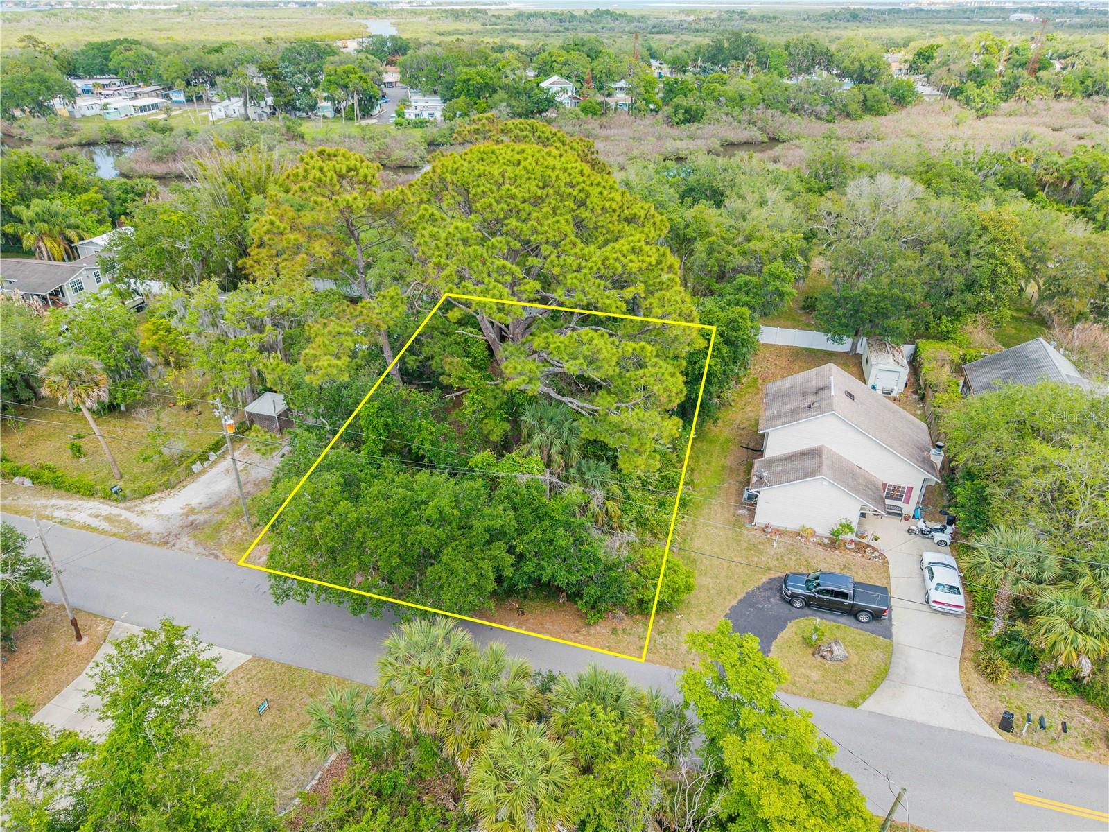 Tucked within the desirable community of Isleboro, this beautifully wooded 100x135 homesite offers the perfect canvas to bring your dream home to life. Surrounded by natural Florida landscape and mature trees, the setting provides both privacy and a peaceful backdrop—while still being just minutes from everything that makes New Smyrna Beach so special.
Known as one of Florida’s best-kept coastal secrets, New Smyrna Beach blends laid-back charm with an elevated coastal lifestyle. From 17 miles of pristine shoreline and world-class surfing to the vibrant energy of Flagler Avenue and Canal Street, the area offers an effortless mix of beach days, boating, local dining, and a thriving arts scene.
This homesite places you right in the middle of it all—just a short drive to the Atlantic Ocean, Intracoastal waterways, marinas, golf, and some of the best fishing and boating on Florida’s east coast. Whether you’re envisioning a modern coastal retreat or a timeless Florida estate, this property is ideally suited for today’s premier builders to create something truly exceptional.
Opportunities like this—where location, lifestyle, and potential align—are becoming increasingly rare. Build your vision, embrace the coastal lifestyle, and experience why so many are choosing to call New Smyrna Beach home.