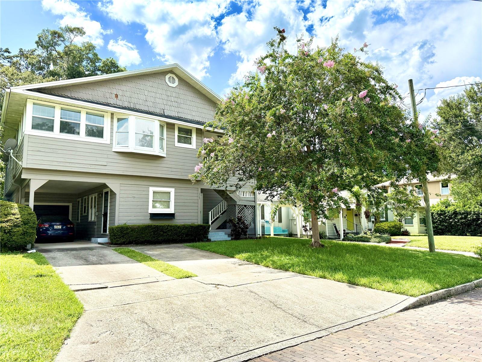 BRAND NEW ROOF JUST INSTALLED AUGUST 2025!!!  A Fantastic Income-Producing Opportunity in One of Orlando’s Most Vibrant and Central Neighborhoods. This Spacious Two-Story Property Features 5 Bedrooms and 3 Bathrooms (2 Bed/1 Bath Downstairs and 3 Bed/2 Bath Upstairs) a One Car Garage and a Carport. Perfect for Investors or Multi-Generational Living. The Home is Currently Split into Two Units: The Downstairs Unit is Tenant-Occupied with Long-Term Stability, while the Upstairs Unit is Currently Vacant and Ready for Occupancy or Additional Rental Income. The Downstairs Tenant has been in Place for 8 Years, Paying $1,550/month with a Current Lease Running Through 12/31/2026. The Upstairs Unit is Larger and can be Rented for $3,000 per month. Tenant is Responsible For Utilities (Electric and Water) and Internet/Cable. The Upstairs Unit Offers Great Potential for Owner-Use or to Generate Additional Income in this High-Demand Area. The Property Boasts Excellent Curb Appeal, a Beautifully Landscaped Front Yard and a Bright, Open-Concept Interior. Inside You’ll Find a Spacious Living Room, Modern Kitchen with Stainless Steel Appliances and Large Bedrooms Including a Primary Suite with Private Bathroom. The Backyard Offers a Peaceful Patio—Ideal for Relaxing or Entertaining. Located Minutes from Downtown Orlando, Shops, Restaurants, Parks and Major Highways, This Property Combines Urban Convenience with Long-Term Investment Potential. Don’t Miss This Income Property in a Prime Orlando Location!