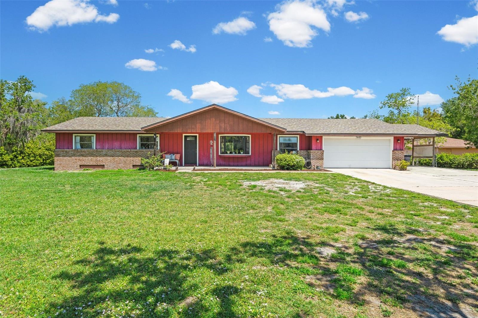 Welcome to a rare opportunity to own a 2 acre property located in the highly desirable East Sarasota community of Racimo Ranches. The main residence and attached 2 bedroom mother-in-law apartment sit on large picturesque lot, no HOA or deed restrictions and not located in a flood zone—offering the quiet privacy and freedom of country living with the convenience of Sarasota’s continued growth just moments away from I-75.  Brand new shopping & dining amenities abound just moments away from this property’s doorstep.
This versatile residence features a well-appointed 3-bedroom, 3 full bathroom main home with a 2-car garage, thoughtfully designed for comfort and functionality. Inside, you’ll find a beautifully remodeled gourmet kitchen (2022) showcasing solid wood, soft-close white Shaker cabinetry, creating a bright and timeless space perfect for gathering. The welcoming, open living room features a large bay window with views of the front yard adding to the overall farmhouse charm.  Major updates provide peace of mind, including a new roof (2025) and a newer AC system with replaced ductwork (2022).  The home has newer luxury vinyl plank flooring throughout. 
Attached to the main residence is a private 2-bedroom, 1-bathroom mother-in-law suite complete with its own full kitchen, living room and carport—ideal for multi-generational living, hosting guests, or generating rental income. This additional residence can either be accessed via a private entrance off the carport or via the main residence. The apartment also features a newer AC system (2024), making it move-in ready and comfortable year-round for guests.  The house has some fixing up projects still to be done and so is a blank canvas for renovating and making the space your own! 
Step outside and experience the true beauty of the land. The expansive 2-acre lot includes a charming chicken coop, several large oak trees, a peaceful small creek running along the back of the property, a cozy fire pit area, and a separate workshop/storage outbuilding—perfect for hobbies, equipment, or extra storage. With no HOA or deed restrictions, you have the freedom to truly make this property your own.
This is a unique opportunity to enjoy the feel of country living in a location that has grown in demand—offering space, flexibility, and endless potential for homeowners and investors alike.