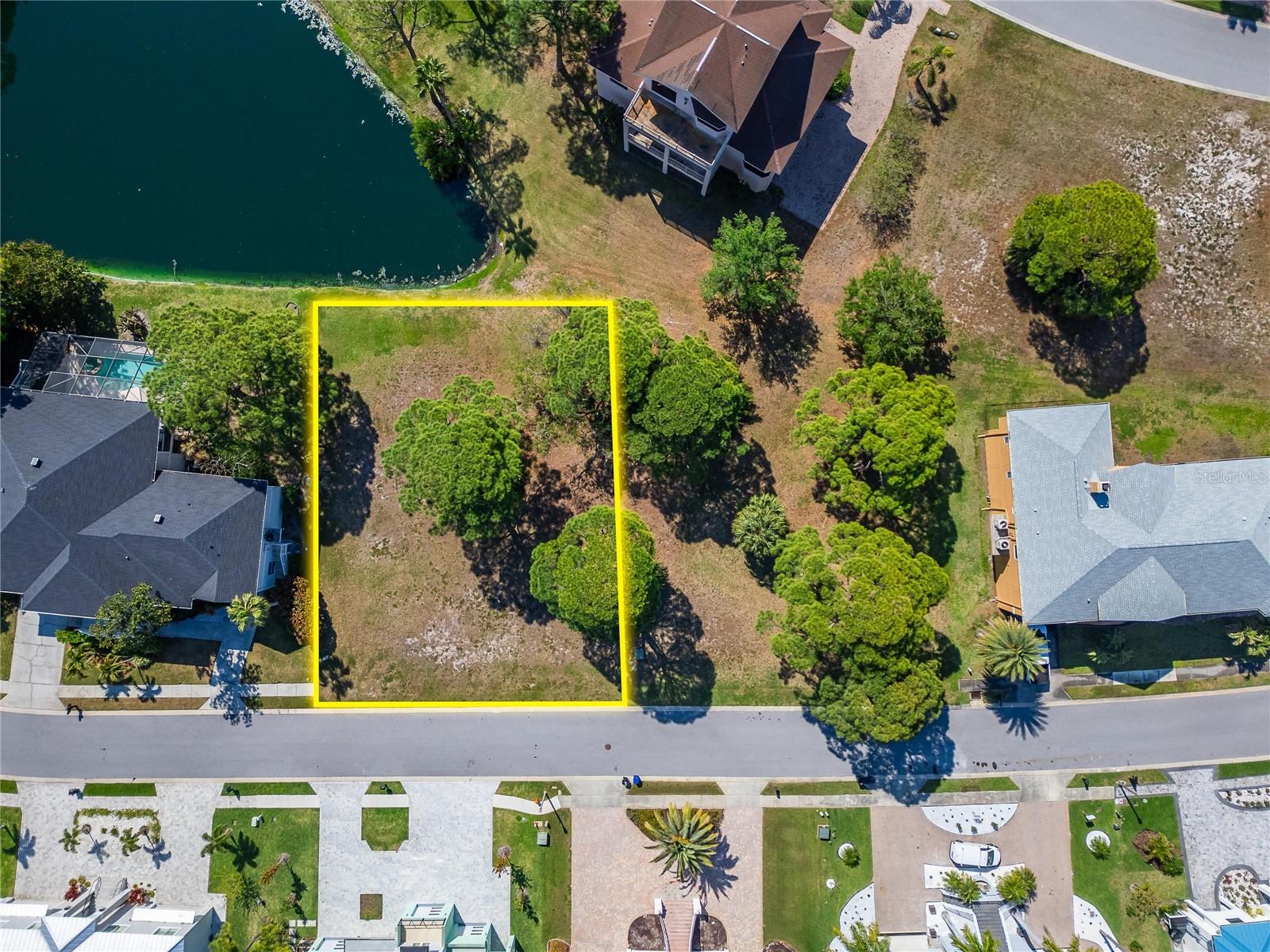 Create your custom coastal retreat in the prestigious Harbour Watch of Tarpon Springs, a highly sought-after gated waterfront community. This exceptional homesite is among the final and most expansive lots available, offering over 12,000 square feet of space to bring your vision to life—with ample room for a spacious residence, outdoor living areas, and a private pool.

Perfectly positioned, the lot enjoys a tranquil pond setting at the rear while capturing the beauty of the Gulf of Mexico just beyond the front. With the right design, upper levels of your future home can take full advantage of stunning water views and breathtaking sunset backdrops.

Residents of Harbour Watch enjoy resort-style amenities, including 24-hour guard-gated security, a clubhouse, community pool and spa, tennis courts, playground, and a scenic gazebo overlooking the Gulf—ideal for relaxing evenings and coastal breezes.

For those ready to build, the seller has a copy of the soil testing from previous owner (November 2020). For those seeking additional space or a larger estate-style footprint, Lots 124 and 125 can be purchased together, creating an exceptional opportunity to expand your vision.

A rare opportunity to secure a premium lot in one of Tarpon Springs’ most desirable waterfront communities—don’t miss your chance to create something truly special.