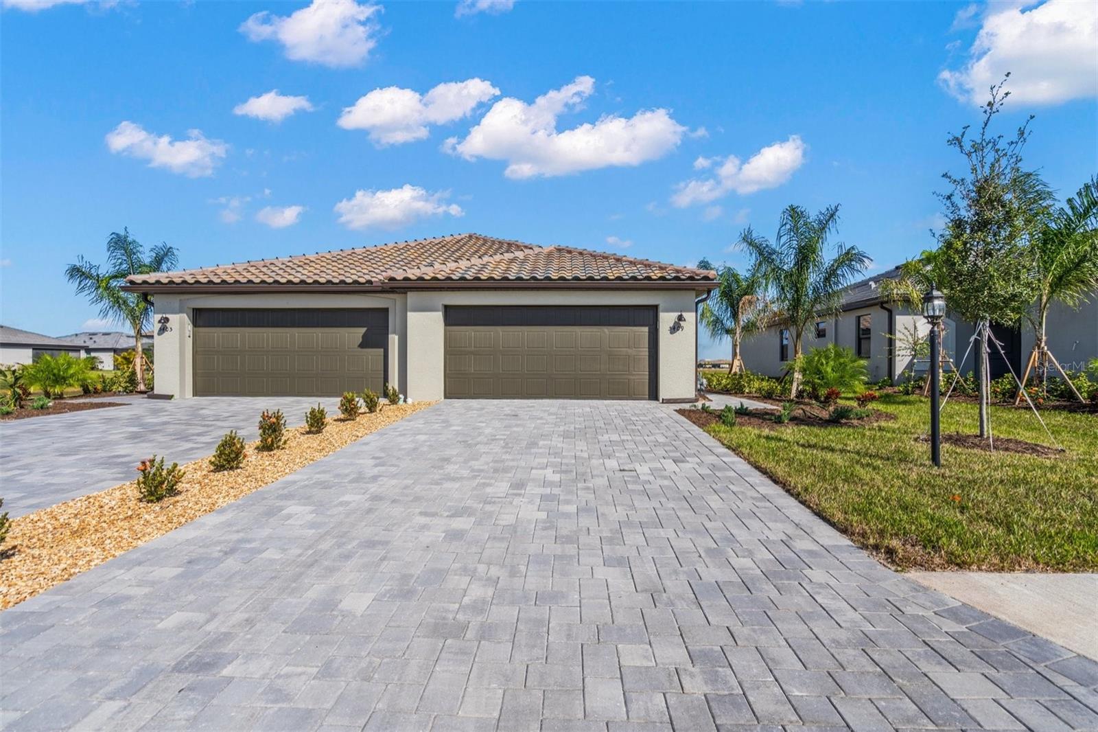 Why wait to build when you can start enjoying the Florida life you've always wanted now! Welcome to your beautiful new home, nestled in one of the newest communities in Lakewood Ranch, Lorraine Lakes! This stunning, BRAND NEW, never lived in 2 bed 2 full bath Villa with an attached 2 car garage, exudes elegance and coziness the moment you step through the door. This open floor plan Orchid model boasts a spacious 1557 sq. ft. of living space that has all the amenities you could possibly want. Upon entry, you are greeted with the bright and airy main living area featuring a HUGE dining and living room with views of the water through the sliding glass doors. The fully stocked kitchen features ample cabinet space, granite counter tops and breakfast bar, and all new stainless steel appliances with gas range. Step right in to the Master Suite you've always wanted, with direct access to your screened in Lanai and sweeping views of the water. The Master Bath features a large walk in shower, dual vanities with granite countertops, and an enormous walk in closet. The second bedroom has built in closets, and enjoy a second full bath with shower/tub combo all to yourself.  This floorpan also features a large den with glass French doors, perfect for a home office or a third bedroom, and separate laundry room with washer and dryer included. Enjoy your morning coffee, or lounge around enjoying the sunshine, all while taking in the breathtaking, picturesque water views from your screened in Lanai. Lorraine Lakes is one of the newest gated communities in Lakewood Ranch and boasts some unbelievable amenities. The clubhouse features everything you could possibly want, including onsite restaurants, tennis, basketball and pickle ball courts, lots of water fun with a recreational and lap pool and splash pad, playground and much much more! Don't miss this opportunity to call this beautiful place yours! Schedule your showing today!