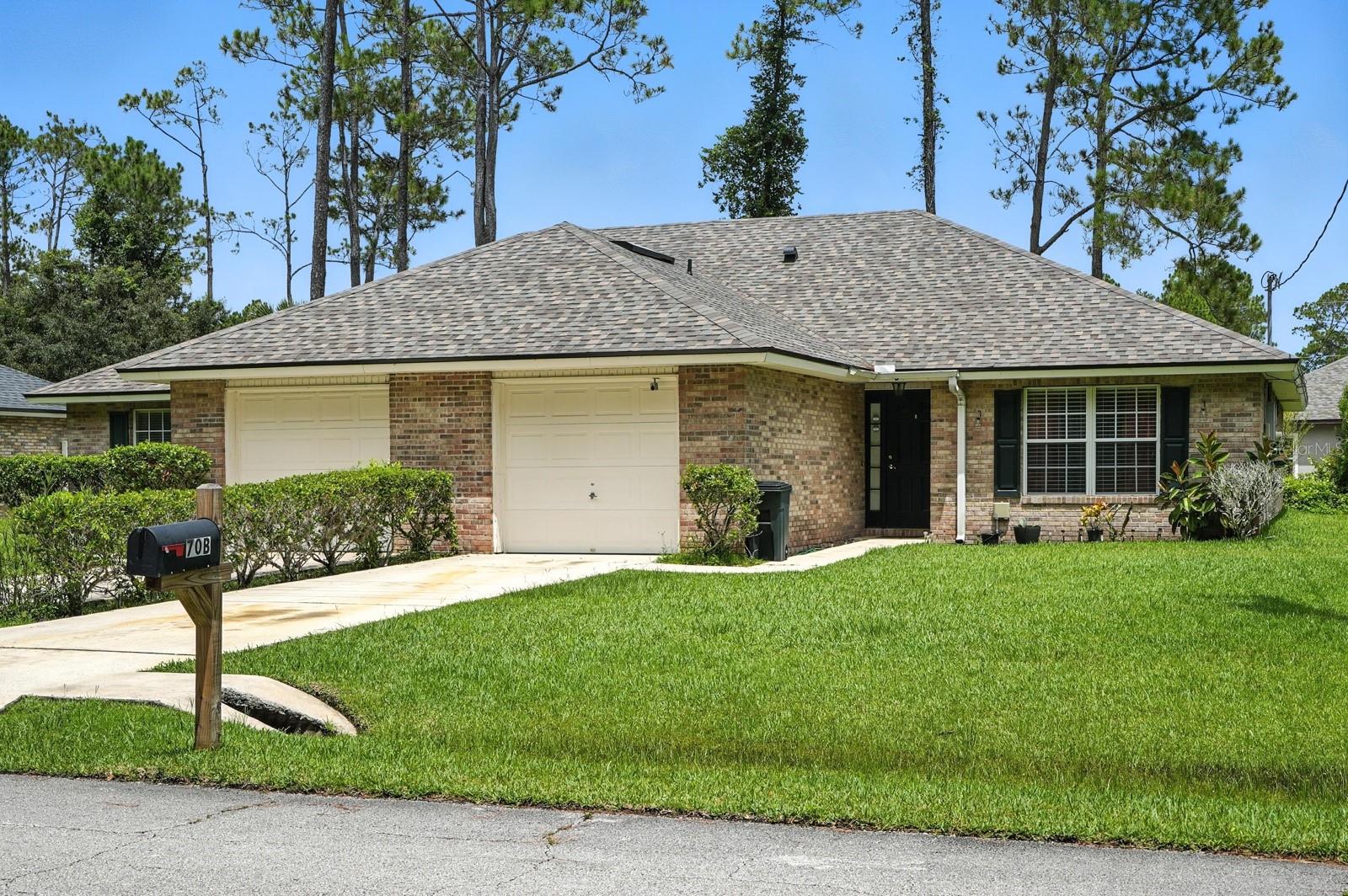 Opportunity awaits with this income-producing duplex located in the desirable Lehigh Woods community of Palm Coast. Each unit features 3 bedrooms, 2 full bathrooms, an open-concept living and dining area, luxury vinyl plank flooring throughout the main living spaces, and comfortable carpeted bedrooms. Sliding glass doors lead to private rear patios, providing each unit with its own outdoor living space.  With identical floor plans on each side, this property offers flexibility for investors, owner-occupants, or multi-generational living.  Situated directly across from a wooded area, the property enjoys a more private setting with no homes immediately across the street. Whether you're looking to expand your investment portfolio, live in one unit while generating rental income from the other, or accommodate multi-generational living, this versatile duplex offers excellent potential. Conveniently located near shopping, restaurants, schools, parks, and easy access to US-1 and I-95, this is a fantastic opportunity in one of Palm Coast's established neighborhoods.