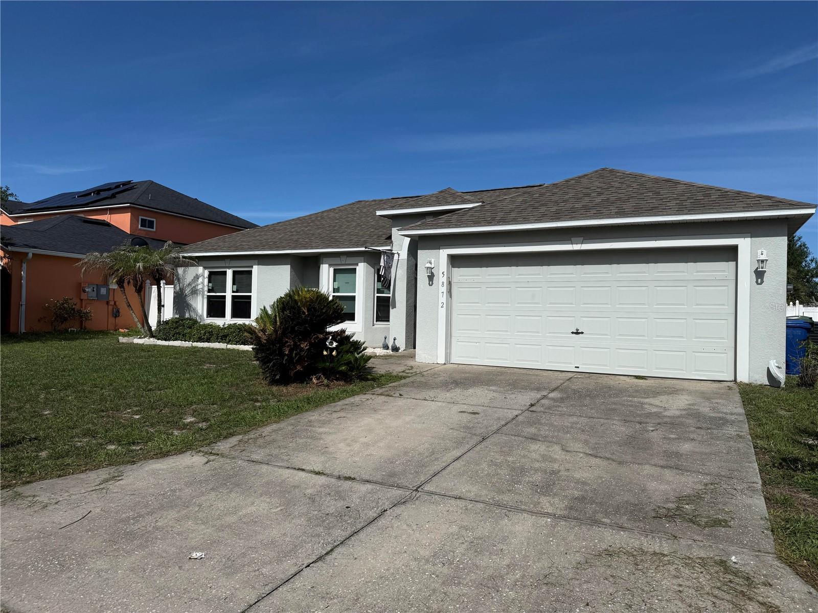 Seller agrees to contribute up to $10,000 toward the Buyer's allowable closing costs, prepaid expenses, and/or interest rate buy-down with a full-price offer, subject to lender approval. Welcome to Royal Hills, where comfort, space, and convenience come together in this beautifully maintained 4-bedroom, 2-bath home. Situated on a quiet street with no rear neighbors, this move-in-ready property offers a desirable split-bedroom floor plan, mature landscaping, and an abundance of indoor and outdoor living space. Step inside to discover soaring ceilings, abundant natural light, and a versatile layout designed for both everyday living and entertaining. The kitchen, dining area, and living room form the heart of the home, creating an open and inviting gathering space for family and friends. The renovated kitchen features granite countertops, a stylish glass tile backsplash, an island, and a raised breakfast/coffee bar overlooking the living room, allowing the chef to stay connected to the conversation. In addition to the main living area, the home offers a spacious family room that provides endless possibilities. Whether you envision a media room, game room, home office, playroom, fitness space, or second living area, this flexible bonus space can easily adapt to your lifestyle. The private owner's suite is thoughtfully positioned on one side of the home and features vaulted ceilings, a walk-in closet, and an en-suite bath. Three additional generously sized bedrooms and a second full bath are located on the opposite side of the home, providing privacy and flexibility for family or guests. An inside laundry room and two-car garage add convenience to everyday living. Enjoy Florida living year-round from the expansive screened porch, accessible through sliding glass doors and offering plenty of space for outdoor dining, relaxing, or entertaining. The fenced backyard includes a storage shed and a large patio area perfect for grilling and gatherings. Additional features include a water softener system, recently installed appliances, a new garbage disposal, and newer A/C, roof, and windows for added peace of mind. Conveniently located near shopping, dining, entertainment, major highways, Legoland, theme parks, and Lake Lucerne, this exceptional home offers the perfect blend of tranquility and accessibility. Schedule your private showing today and experience all that Royal Hills has to offer!