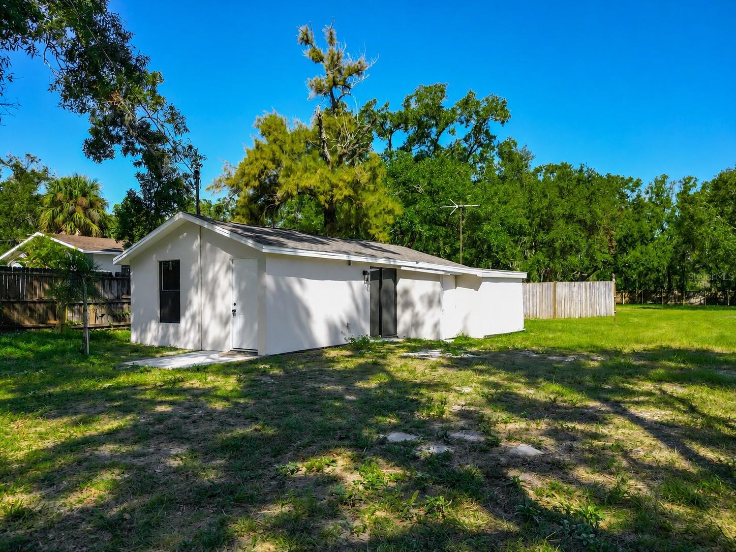 Virtually Staged. Rare opportunity to lease a fully fenced half-acre property offering the space, flexibility, and convenience that’s nearly impossible to find this close to downtown Tampa. Located minutes from downtown and from Seminole Hard Rock Hotel & Casino, US-301, I-4, and the Selmon Expressway, this unique property provides abundant room and flexibility for your vehicles, trailers, boats, and outdoor needs, while still being close to everything Tampa has to offer. If you’ve been searching for a property that offers both a beautifully renovated home and exceptional outdoor space, this is it. The home has been beautifully renovated and features a bright open-concept layout with a stunning kitchen showcasing quartz countertops, white shaker cabinetry, stainless steel appliances, a large center island, luxury flooring, mini-split air conditioning, and a beautifully remodeled bathroom with a marble-inspired walk-in shower. Every detail has been thoughtfully updated to create a clean, modern living space that’s move-in ready. Whether you simply need the convenience of a large lot, room for your vehicles and boats, or space for your outdoor lifestyle, this property offers a rare combination of modern living and exceptional outdoor space. Enjoy quick access to downtown Tampa, Ybor City, the Port of Tampa, Tampa International Airport, shopping, dining, and major highways, all while having the privacy and flexibility of your own fully fenced half-acre property. Please inquire to discuss your specific needs.