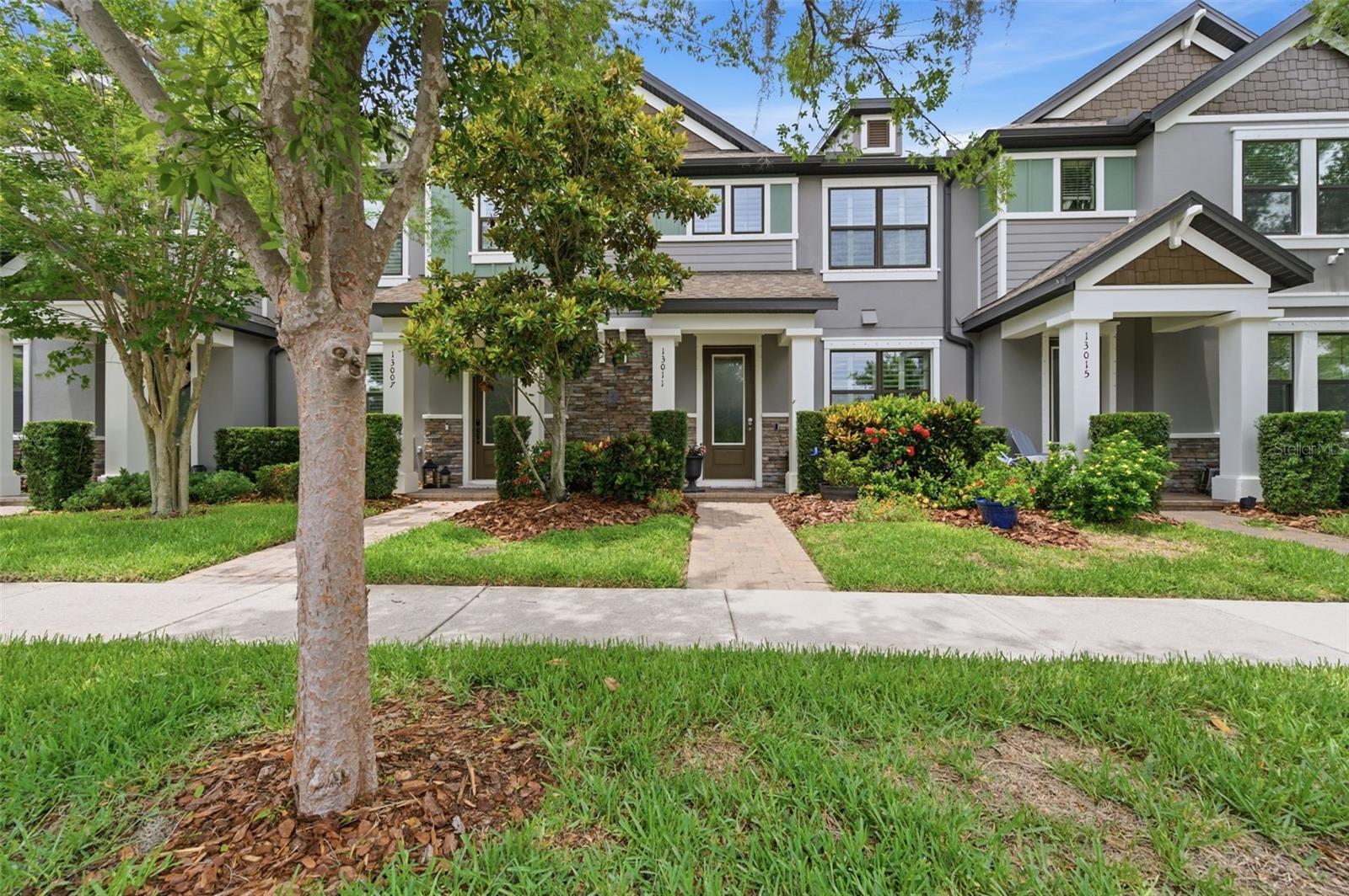 This beautifully designed Townhome blends modern elegance with everyday comfort, featuring stylish, carpet-free living spaces and thoughtful upgrades throughout—including custom plantation shutters.  The chef’s kitchen is a true centerpiece, showcasing Stainless Steel Appliances, a Gas Range, NEW Quartz countertops with Upgraded Sink, Oversized Island, rich Wood cabinetry, Breakfast Bar, and a spacious Walk-In Pantry. Additional highlights include a custom electric fireplace, a fully equipped Laundry Room, and a custom Butlers Pantry—perfectly balancing function and style.  A Wood staircase leads to the upper level, where you’ll find a generous Primary suite and two additional Bedrooms. Enjoy peaceful pond views from the primary bedroom and unwind on the screened, paved lanai—ideal for relaxing or entertaining. A covered walkway connects to the attached 2 Car Garage, adding to the home’s smart and convenient layout.  Located in the highly desirable Starkey Ranch, this home offers an unmatched lifestyle with resort-style amenities, scenic lakes, lush green spaces, and nature preserves. Residents enjoy a maintenance-free lifestyle, with the HOA covering exterior upkeep, landscaping, reclaimed irrigation water, pest control, trash, recycling, and access to premium community features.  Everything you need is just moments away, including Starkey Market, top-rated K–8 schools, shopping, dining, and medical facilities close by. Plus, you’re only about 30 minutes from downtown Tampa and the Gulf beaches.  A perfect combination of style, convenience, and location... LET'S GET IT SOLD!