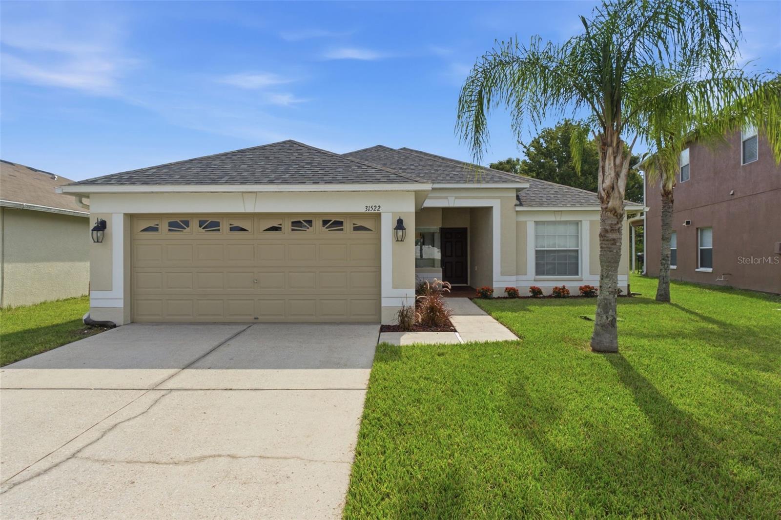 Welcome home to this 4-bedroom, 2-bath pond-view home in the heart of Wesley Chapel's Bridgewater community! The split, open floor plan lives large, with a spacious great room that flows to the eat-in kitchen featuring granite countertops, stainless steel appliances, and ample cabinetry - all overlooking tranquil pond views out back. The private primary suite offers a large walk-in closet, dual-sink vanity, soaking tub, oversized glass-enclosed shower, and also a view of the pond in the backyard. Three additional bedrooms, an interior laundry room, and a 2-car garage round out the home, with high ceilings and easy-care tile and luxury vinyl flooring throughout. The location cannot be beat: just minutes from a brand new Publix, Swig, Starbucks, Chick-fil-A, and more, plus the brand new Learning Experience daycare and several top-rated schools - including highly rated Garden Montessori and Kirkland Ranch, one of only two magnet schools in Pasco County. Pick up fresh farm produce minutes away at Boyette Farms, and enjoy peace of mind with the brand new Johns Hopkins hospital nearby. All this plus a low annual HOA, the Epperson Crystal Lagoon, KRATE at the Grove, first-class shopping and dining at The Shops at Wiregrass and Tampa Premium Outlets, and quick access to I-75. Schedule your private showing today!