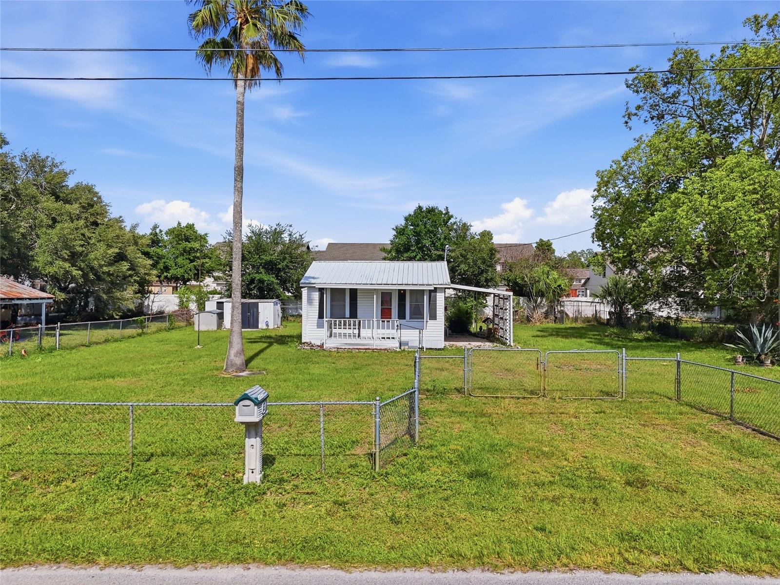 Virtually Staged. NO HOA | FULLY FENCED | METAL ROOF | BONUS ROOM | HURRICANE SHUTTERS | Charming and well-maintained 1 bedroom, 1 bathroom home with a BONUS ROOM, ideally located in the heart of St. Cloud. Situated on a spacious 0.29 acre lot, this property offers a fully fenced yard with plenty of room for outdoor living, pets, storage, boats, trailers, or work equipment.

The home features a metal roof, hurricane shutters, and no HOA, giving you flexibility and peace of mind. The bonus room provides added versatility and can be used as a home office, second bedroom, guest space, or flex space to fit your needs.

Enjoy being just minutes from the St. Cloud Lakefront, known for its scenic views, walking trails, playgrounds, and boating access to East Lake Tohopekaliga. You are also close to Downtown St. Cloud, where you will find local shops, restaurants, and community events throughout the year.

Whether you are looking for a primary residence, a seasonal home, or an investment opportunity, this property offers a great location with room to make it your own.