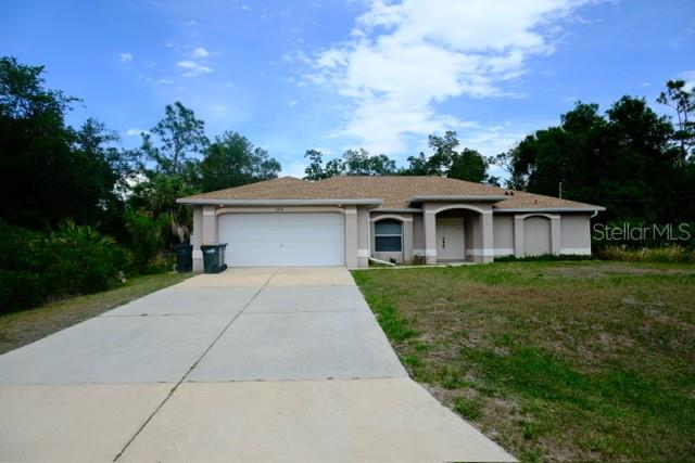 Back on Market after satisfactory inspections and appraisal, this 3-bedroom, 2-bathroom home (plus a den) offers an incredible split floor plan, designed for effortless flow to blend cozy, personal spaces with bright and open areas for entertaining. Featuring built-ins for your decor, high ceilings, an airy, open great room, central kitchen with a breakfast bar, separate dining area, and a dedicated office/den with French doors (perfect for a 4th bedroom). Sliding pocket doors separate the central gathering spaces of the home from both the laundry room, and a private hall to the secondary bedrooms, and bathroom. An extra large, 3-panel glass slider allows Indoor/Outdoor flow from the great room to the covered and screened lanai, which overlooks a private backyard (room for a pool!) - completely surrounded by vacant wooded land. The Primary Suite highlights include sliding glass doors to the lanai, dual walk-in closets and an en-suite with garden tub, dual sinks, and a tiled walk-in shower. Roof, HVAC, and water heater were all replaced in 2024 for ultimate peace of mind, this home is ready for your personal touch and TLC. Nestled in a quiet, NO FLOOD ZONE, NO HOA neighborhood, and still close to I-75, US-41, Gulf beaches, golf, and Spring Training stadiums. This home is a MUST SEE!