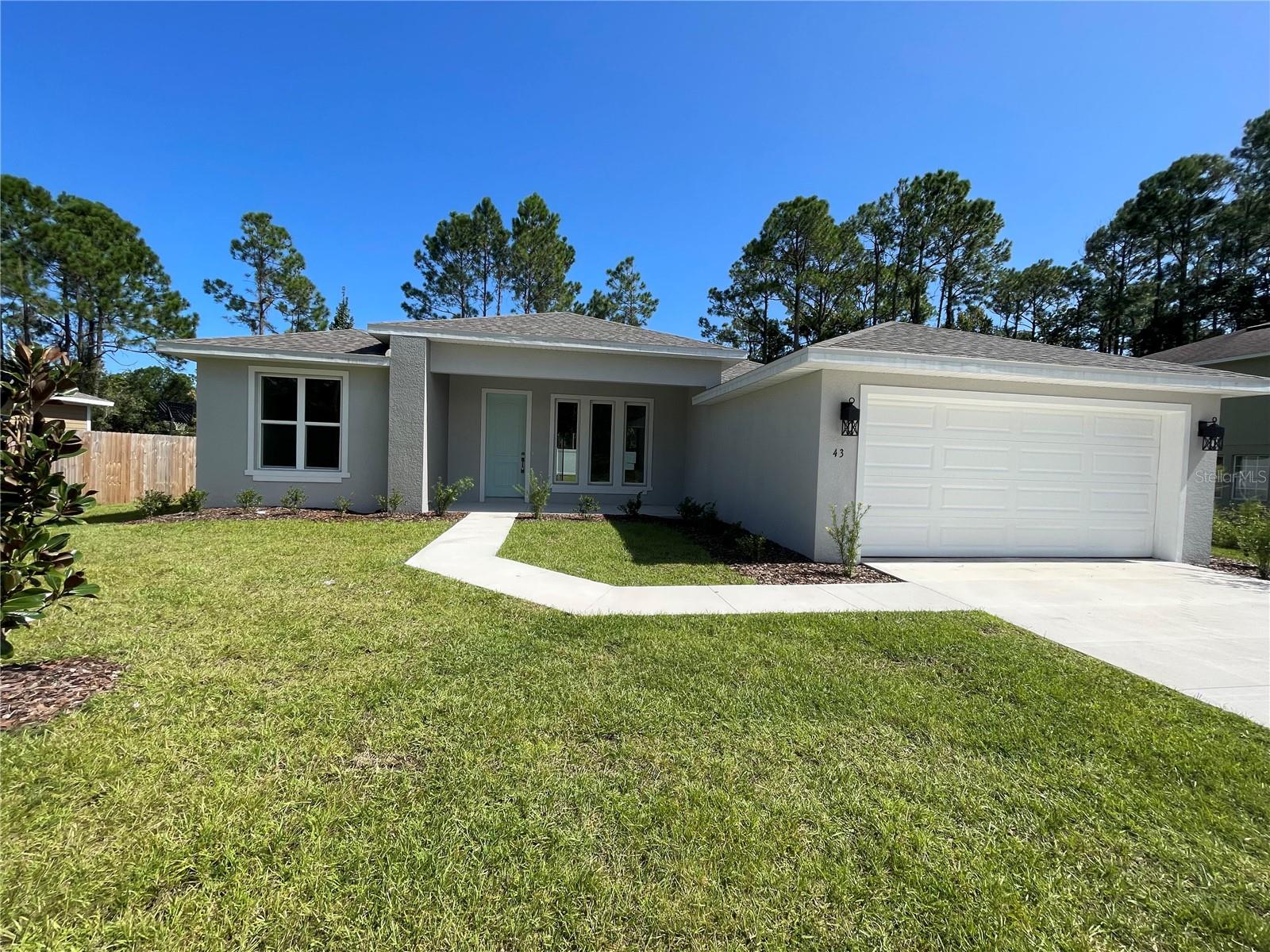 Completed home, fully fenced in back yard with vinyl fencing. This beautiful floor plan is open and spacious with 9'4'' ceilings, 8' entry door, 3 bedrooms, 2 baths and a 2 car garage. Open concept, split floor plan, Kitchen with quartz counters and a kitchen nook area for family meals, with stainless steel dishwasher, stove and microwave,  guest bathroom features LVP flooring, tub with tile to the ceiling, vanity with quartz countertop, Owners suite has LVP flooring, shower with tile to the ceiling, double sink vanity with quartz counter tops, water room and a linen closet.   Master bedroom features a walk-in closet and additional closet space on the adjacent side.  LVP flooring throughout with carpet in the bedroom. Plenty of natural sunlight from the 3 beautiful windows in the front of the home overlooking the front porch, sliders leading out to the back lanai. Underground electricity to the home. Call now before this is no longer available. 
Some photos are of the model home at 194 Bird of Paradise which has added upgrades.