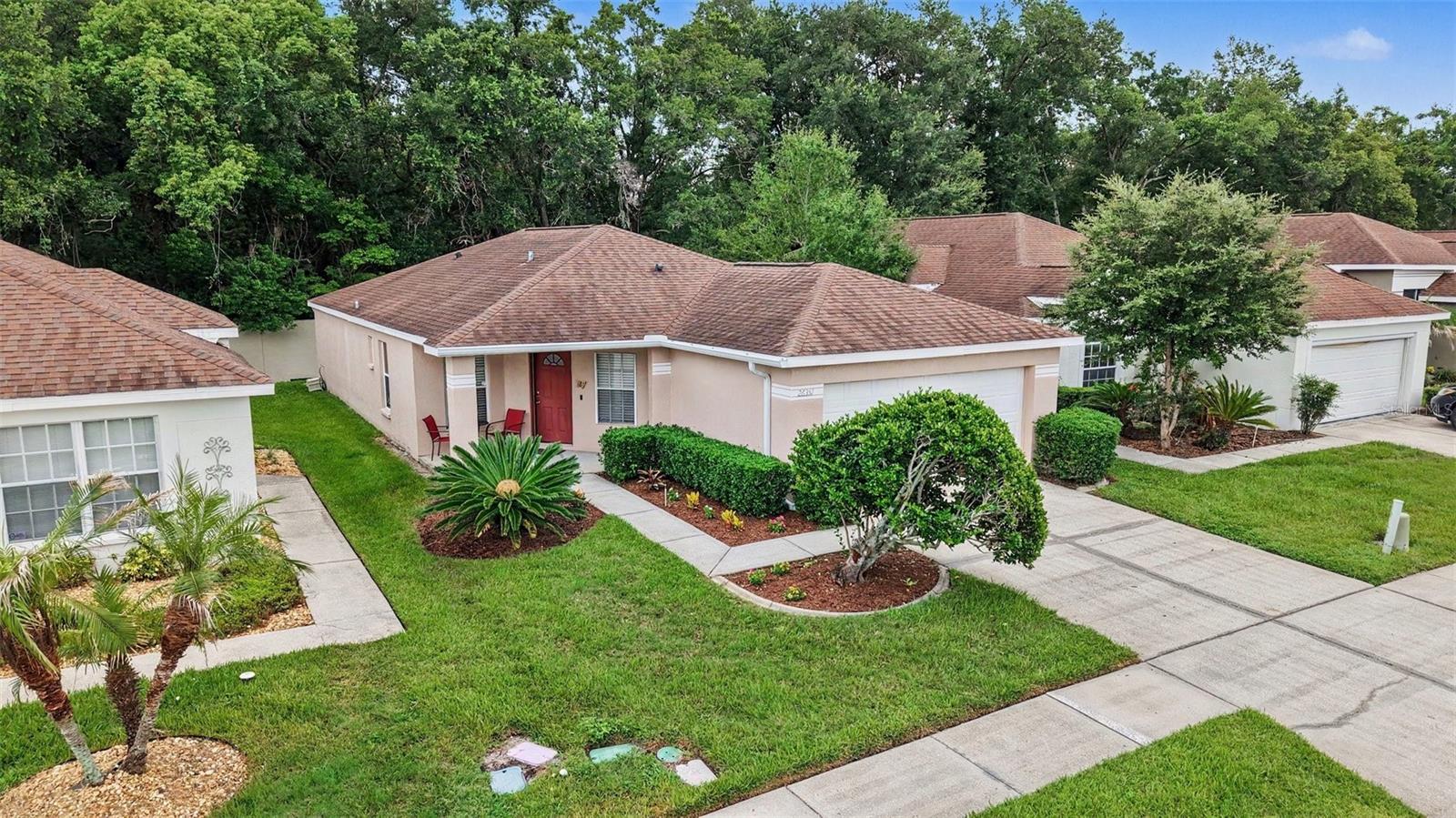 Well-maintained 3 Bedroom, 2 Bath, 2 Car Garage home located in the gated Churchill section of Lexington Oaks of Wesley Chapel. This golf community has many amenities (see below). Your reasonable HOA fee includes Roof, Exterior Maintenance/Painting and Lawn Care. This remodeled home is immaculate and features a split floorplan with ceiling fans/lights in each room and ceramic tile in common areas. An Upgraded Kitchen offers wood cabinets, granite countertops, both breakfast bar & nook, stainless steel appliances and multi-stage reverse osmosis water system. The Primary Suite presents with a large walk-in closet, granite countertop with dual sinks, walk-in shower and water closet. The Back Porch is screened and covered offering plenty of privacy. Additionally, you’ll enjoy the benefits of a whole house, salt-free water conditioning system. AWESOME AMENITIES: Access to an 18-hole championship layout Golf Course, Fitness Center, Pool, Clubhouse, Tennis/Pickleball & Basketball Courts, Sand Volleyball, Soccer Fields, Playground and an additional Pool, private to this gated section. Furniture optionally available. LOCATION: Publix, Walmart, Costo & Premium Outlets all within 10 minutes, Downtown Tampa & Tampa International Airport within 35 minutes and 5 minutes to I-75 with quick access to all the restaurants, shopping, and entertainment for which the Tampa Bay area is known. Look for links to the Walkthrough Video and request your showing today!