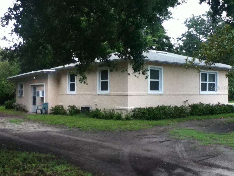 *Investor Alert* or those seeking an Extra Income Producing Property! Lots of Possibilities! Flexible Ownership Usage; This Corner Lot, Two Unit Single Family Rental Property could also be Single Family Owners seeking extra Income or needing an additional separate In-Law Suite Efficiency Apartment complete with 2nd Kitchen, Full Bathroom and Walk-in Closet or a larger or extended family just needing more space and options! Located in New Smyrna Beach Florida just a short 10–15-minute drive to the Drive-On Beach, or a 5-minute drive to the Intracoastal for fishing, boating, parks, dining, shopping and all that this Coastal Community has available! A short, less than ten-minute drive to Route 95 for longer distance travel. Strong Cash Flow and Return On Investment for Investors (currently $3,375 / Month total gross) or new Home Owner can choose to offset their expenses by up to $1,325 / Mo. by renting out the Efficiency Apartment or by $2,050 / Month by renting out the Main Home and living in the Efficiency Studio Apartment. The Main Home features Two Bedrooms, both with walk-in closets, one Bathroom, Kitchen, Dining Area, Living Room and Bonus Room which could act as a third Bedroom (but no closet) or Office or Den or Sitting Room. Nice Hardwood Floors throughout the Living and Bedrooms while the Kitchen and dining and adjacent room receive Porcelain Tiles for easy cleanup and maintenance. The studio Efficiency Apartment features two Separate Entrances, a flexible Living/Sleeping Space with Ceiling Fan and Walk-in Closet, a separate Full Kitchen and Dining Area and a Full Bathroom with Shower (and a second natural Gas Water Heater). The Main Home and Efficiency Apartment both have Two Separate Entrances as well as Separate Off-Street Parking Areas. The corner Lot yard has some mature trees and Landscaping to accent its surroundings and spacious feel. The home has been well maintained and recently painted inside and out. Now is your chance to Own an Income Producing slice of sunshine in this wonderful community by the water. 
Note: Listing Agent has an interest in the property. Please verify all Details and Dimensions.